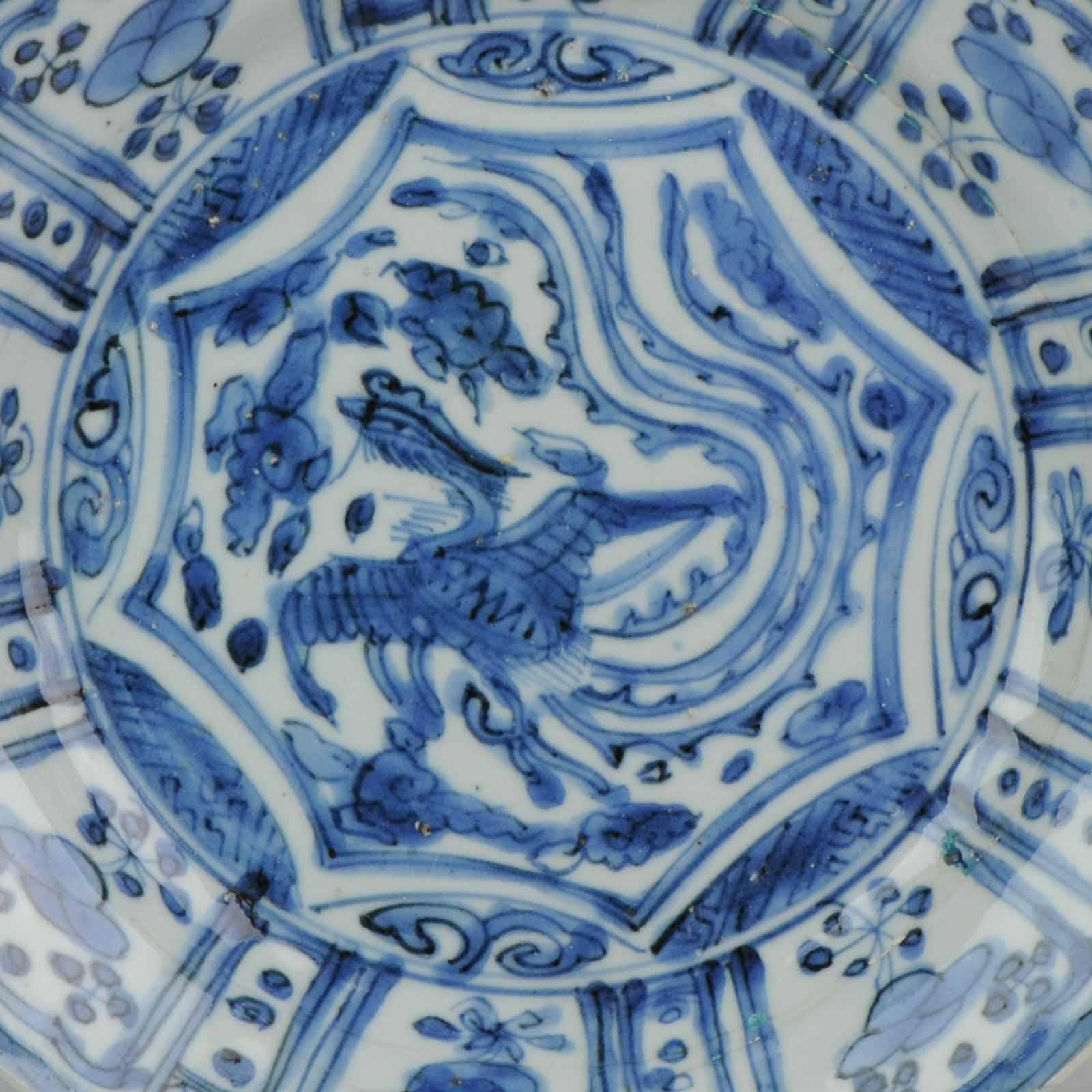 A very nice kraak dish of a desirable cobalt color blue! Stunning piece with beautiful paintwork.

The scene of a phoenix is quite uncommon on Kraak porcelain. The phoenix is the symbol of the Empress.
Very nice. In beautiful display