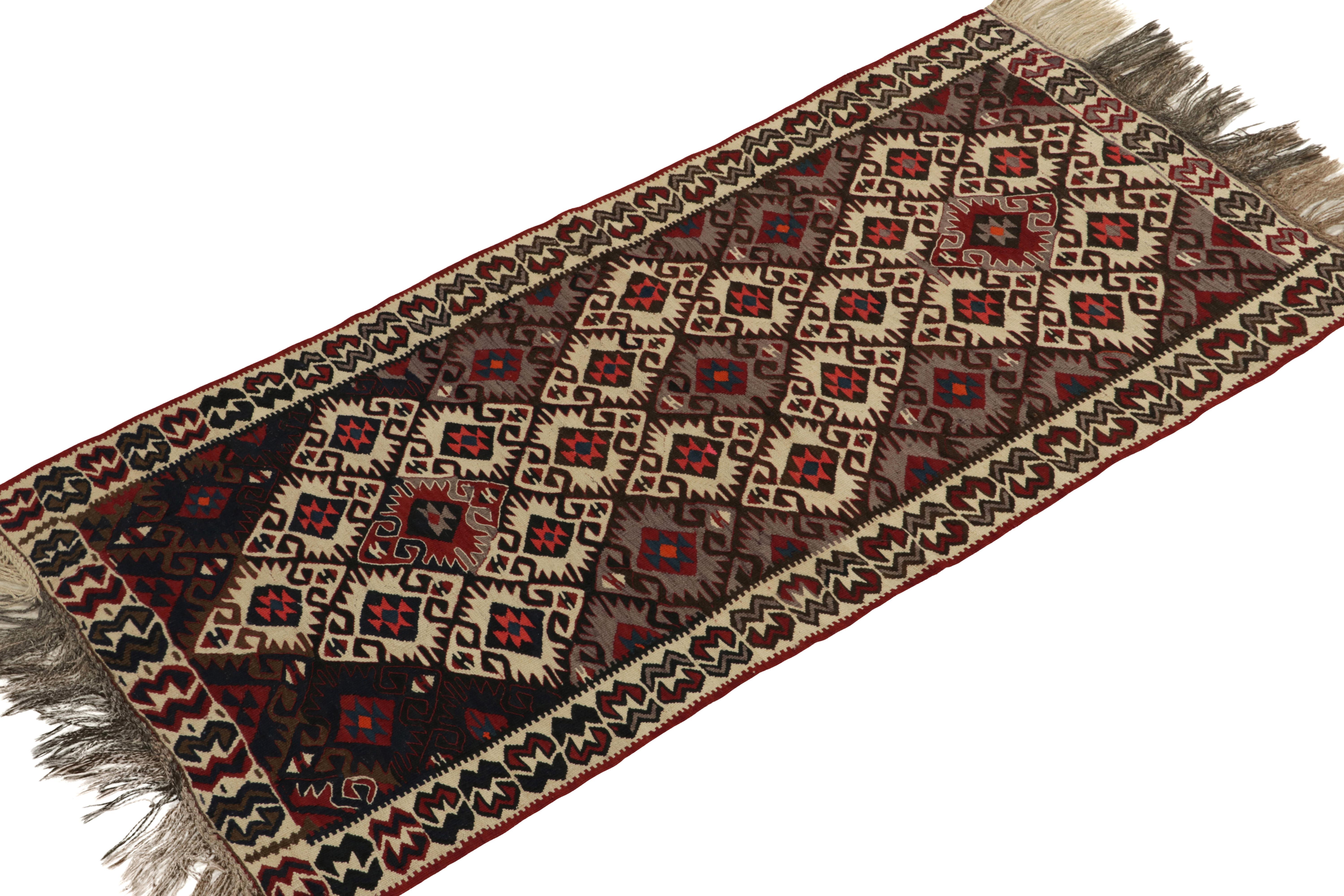 Handwoven in wool, this antique kilim runner connotes the richness of Turkish tribal aesthetics of the early 1900s. 

On the Design: The 3x6 masterpiece carries a dense tribal field design with traditional symbols like  beige elibelinde “hands on