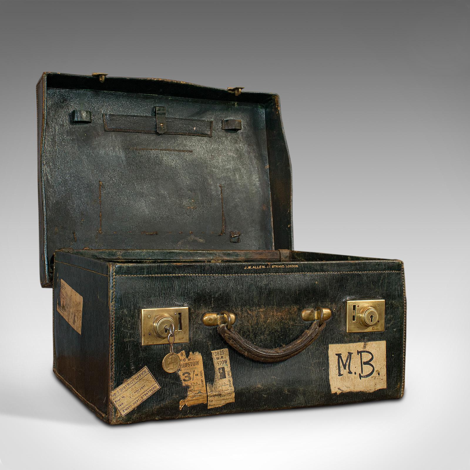 This is an antique travel case. An English, leather salesman's suitcase, by JW Allen, of 37 Strand in London, dating to the Edwardian period, circa 1910.

Quality Edwardian luggage
Displays a desirable aged patina
Stitched leather exterior in