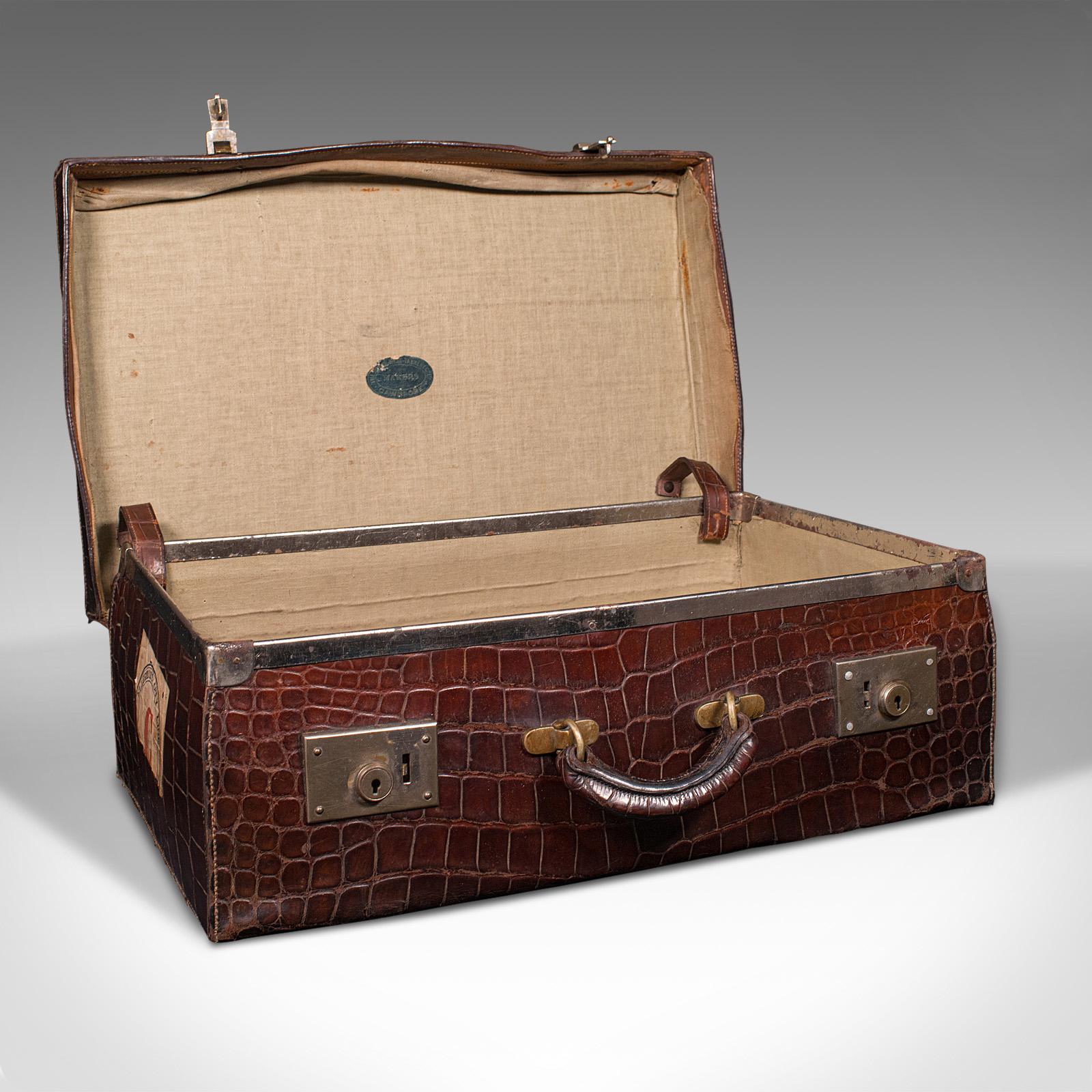 This is an antique traveller's suitcase. An Indian, crocodile skin case, dating to the Edwardian period, circa 1910.

Fascinating colonial era suitcase with antique travel appeal
Displays a desirable aged patina throughout
Genuine crocodile hide