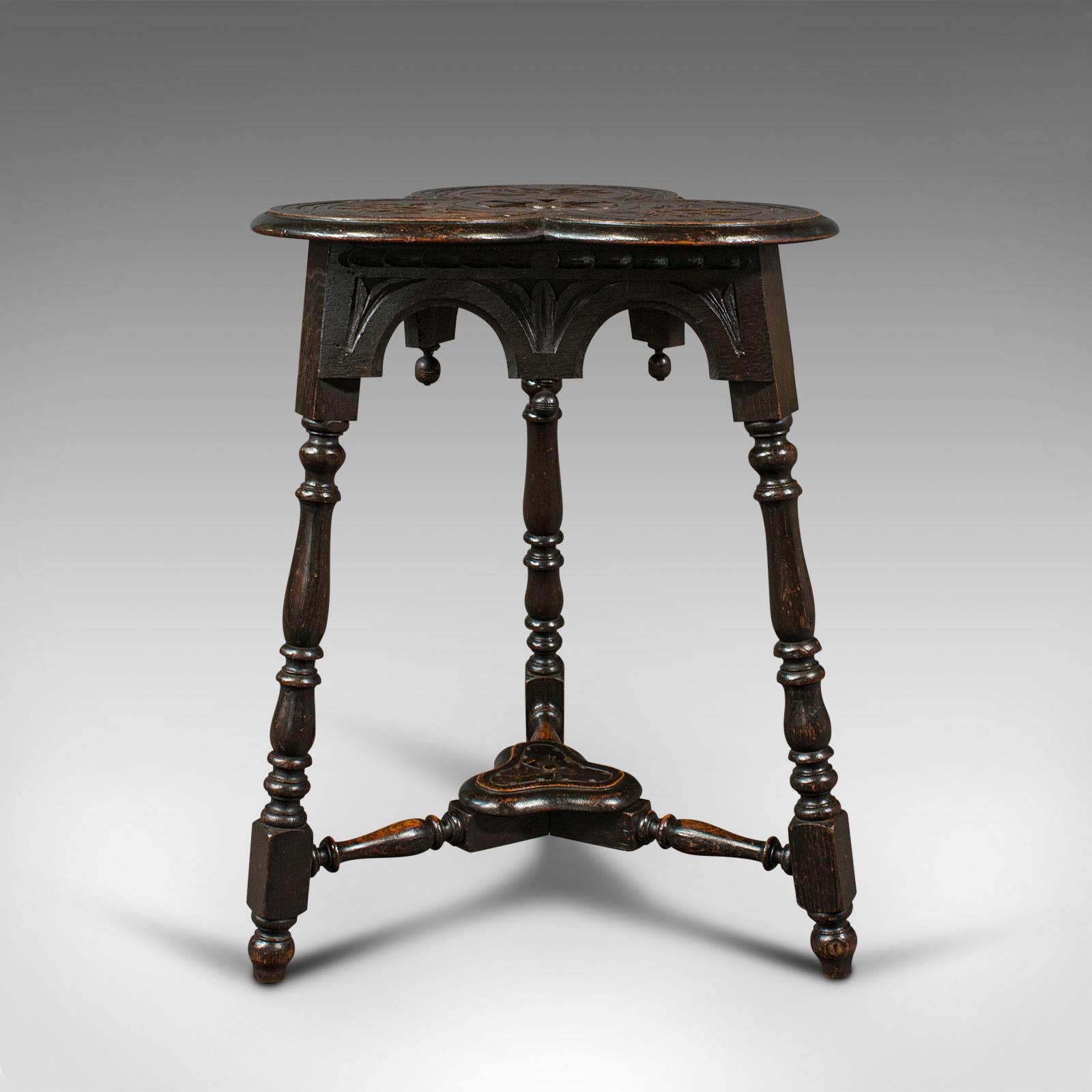 This is an antique trefoil side table. A Scottish, oak lamp or wine table with Aesthetic period taste, dating to the Victorian period, circa 1880.

Highly distinctive table with great tonality and detail
Displays a desirable aged patina