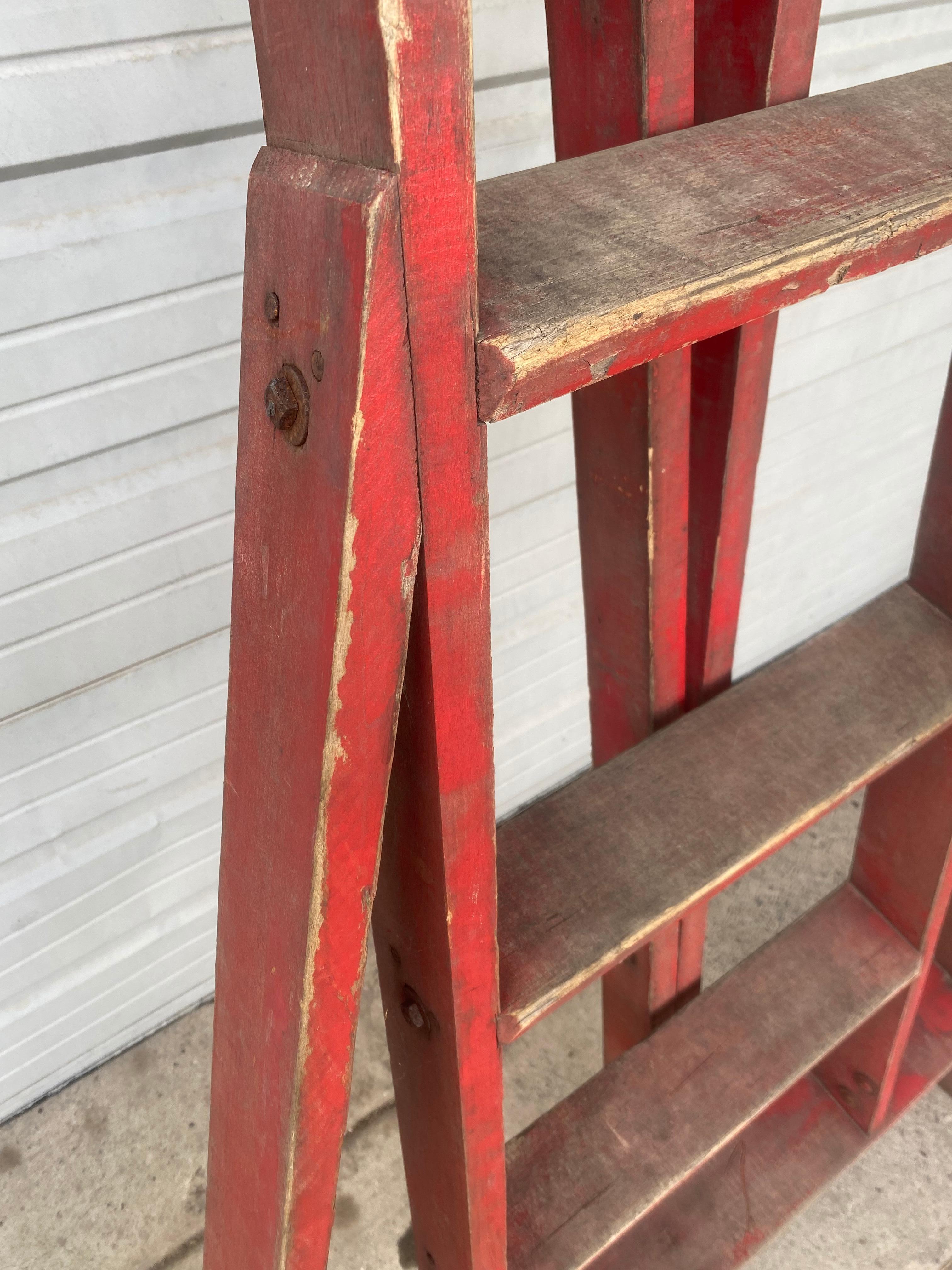 Early antique tri-pod orchard (fruit picking) step ladder. Great red color, retains original finish, surface, patina. Classic design,Hand delivery avail to New York City or anywhere en route from Buffalo NY.