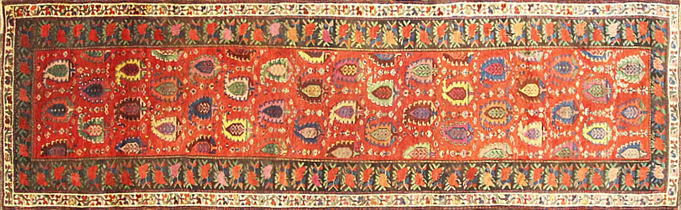 Antique handmade tribal Caucasian Karabagh Runner, Circa Date: 1890, The first things that draw your eye to this carpet are the brilliant colors and Oriental-style design. Karabagh is a region in the southern Caucasus mountains in a region that is
