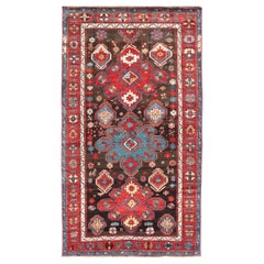 Ancien tapis tribal caucasien Kazak en brun et rouge à motifs géométriques