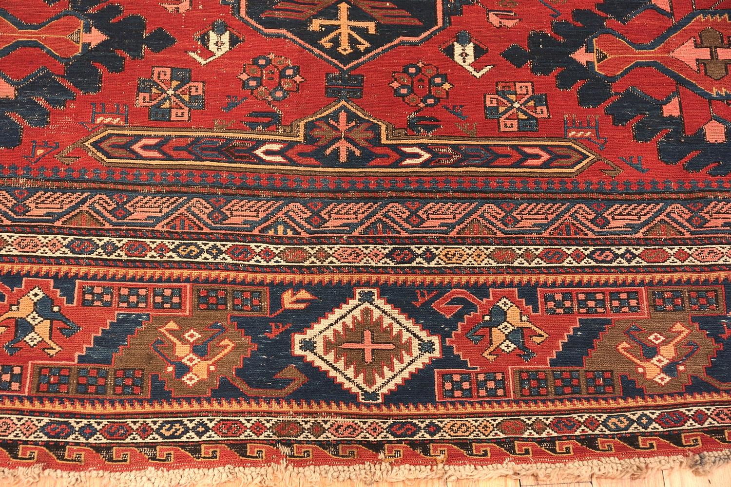 Beautiful antique tribal Soumak rug, country of origin: Caucasus, date circa 1900. Size: 9 ft. 2 in x 11 ft. 4 in (2.79 m x 3.45 m). 

This gorgeous tribal rug from the Caucasian mountains was created around the turn of the 20th century. It features