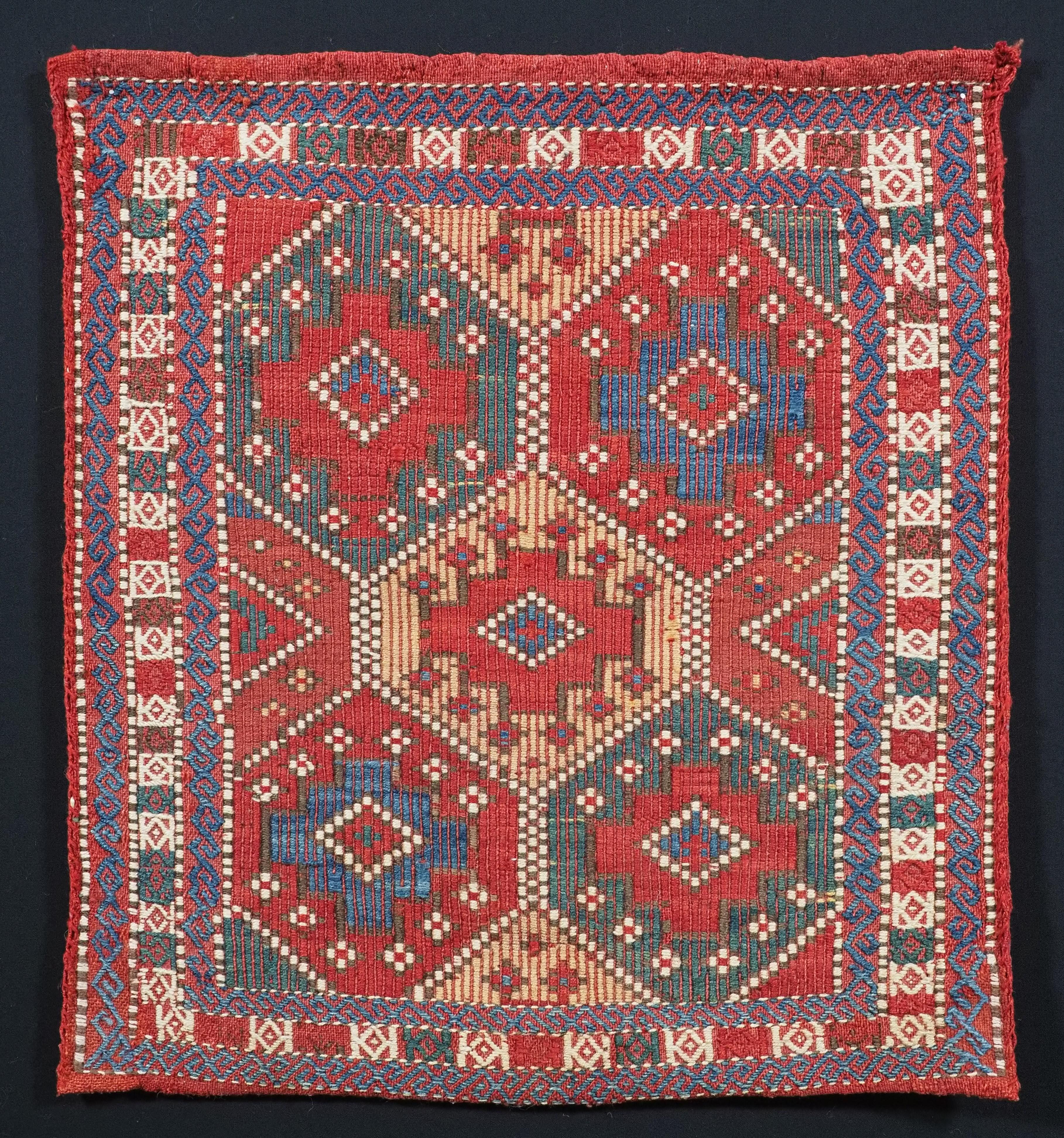Size: 1ft 8in x 1ft 6in (51 x 46cm).

Antique tribal chanteh (vanity bag) with plain weave back, by the Azeri Tribes of Azerbaijan.

Circa 1900.

A good small bag to contain personal belongings, woven in a brocade technique. The bag retains the