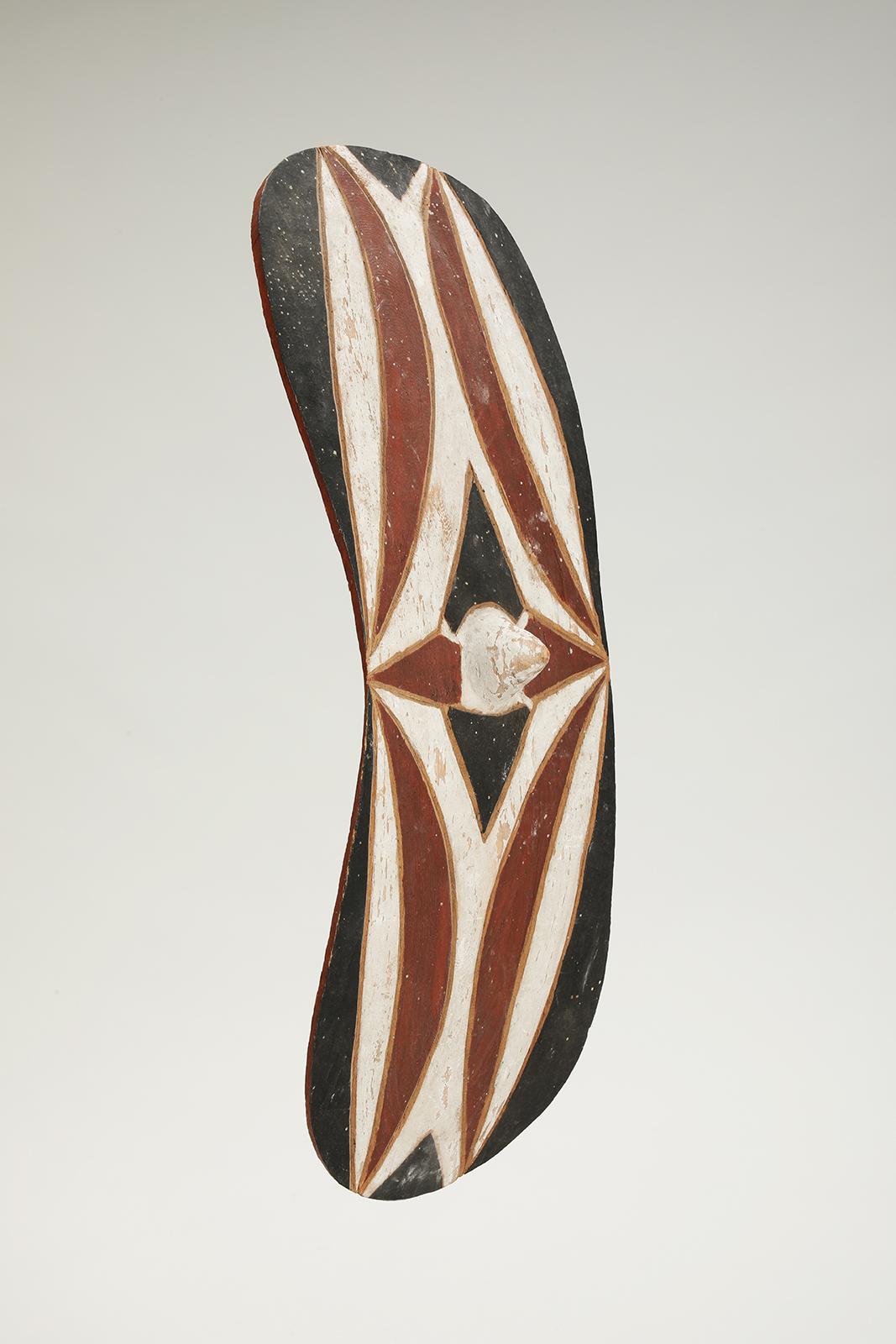 Tutsi Ceremonial dance shield.
Rwanda-Burundi
Second quarter, 20th century.
Wood, natural pigment
Measures: 20” long x 7 1/4” wide x 4” deep (50.5 x 18 x 10 cm).
Provenance: Colonial period collection, Belgium (before 1959).