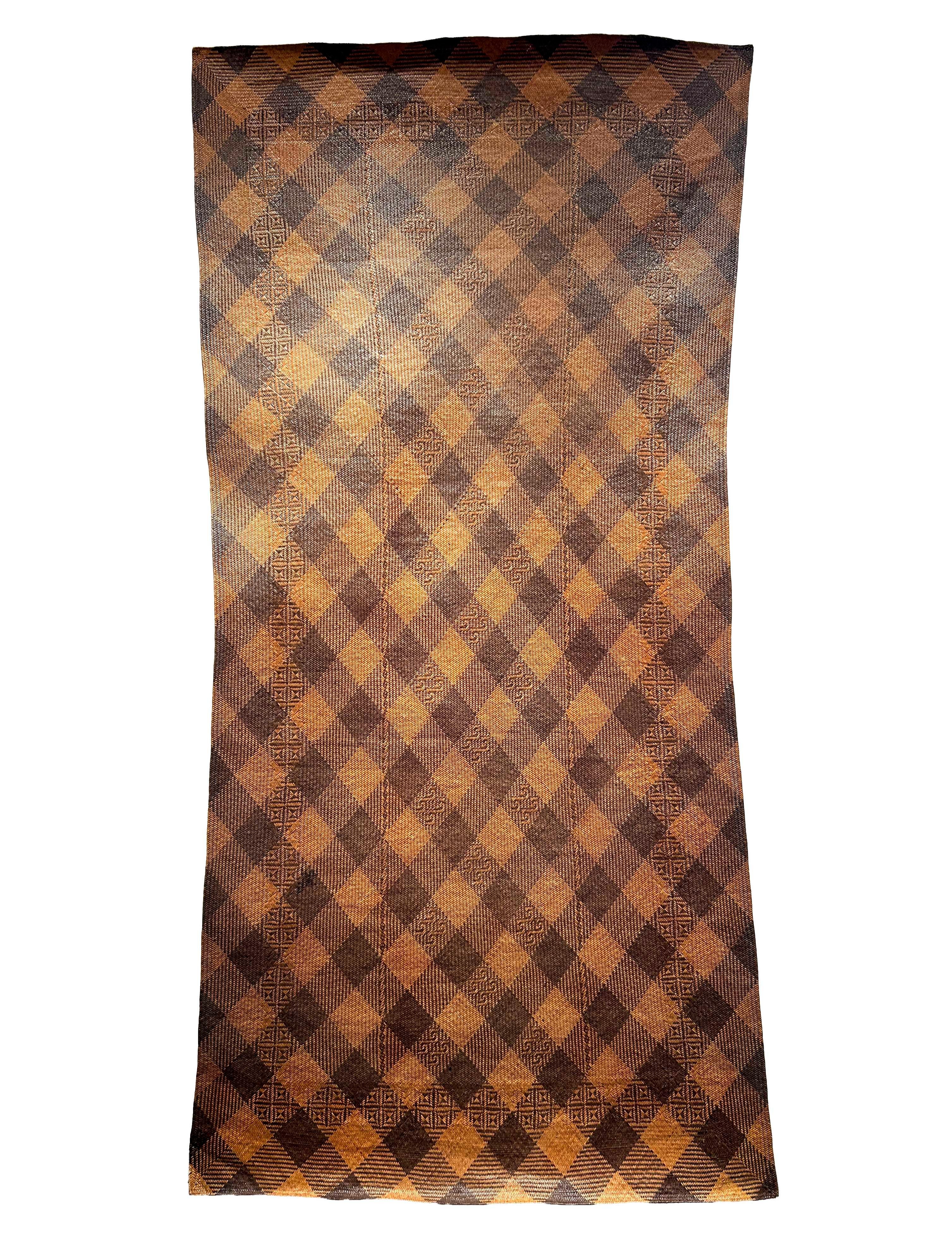Antique Tribal Dayak Plaited Rattan Longhouse Mat (Tikar), Kalimantan

The tightly woven longhouse sleeping mats of Kalimantan are almost exclusively constructed by women, who begin their rattan plait work from one corner and work outward until the