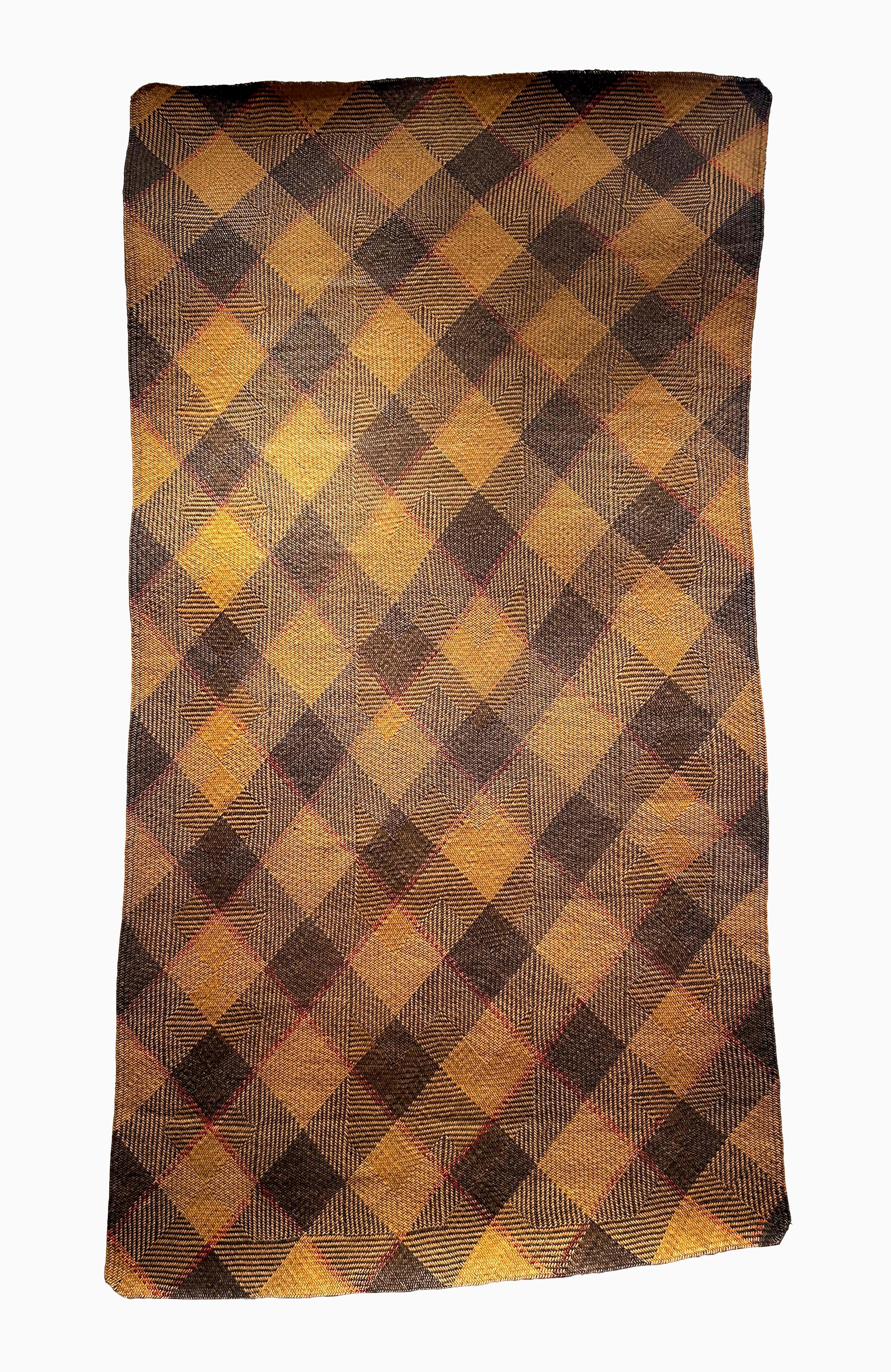 Antique Tribal Dayak Plaited Rattan Longhouse Mat (Tikar), Kalimantan

The tightly woven longhouse sleeping mats of Kalimantan are almost exclusively constructed by women, who begin their rattan plait work from one corner and work outward until the