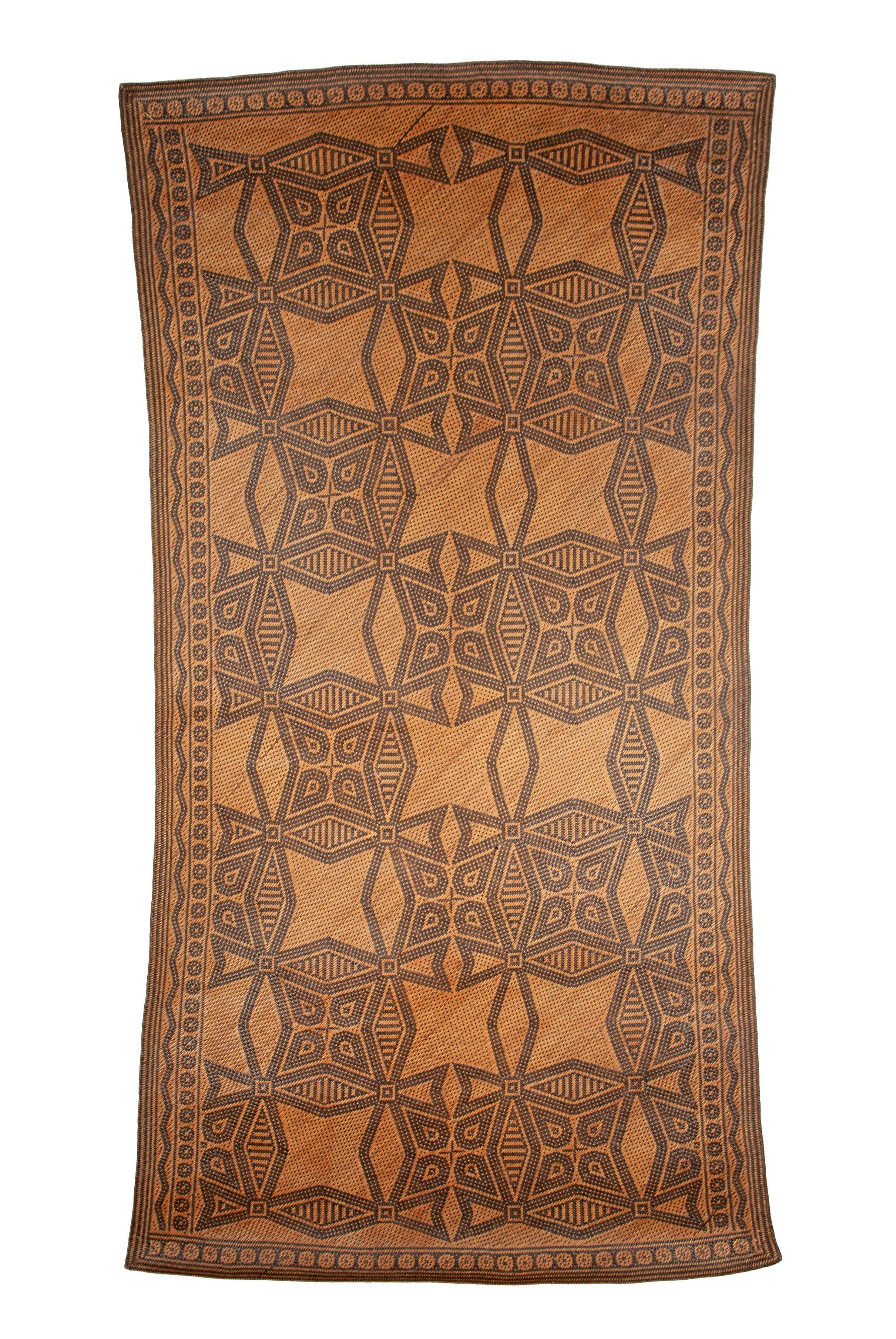 Antique Tribal Dayak Plaited Rattan Longhouse Mat (Tikar), Kalimantan

The tightly woven longhouse sleeping mats of Kalimantan are almost exclusively constructed by women, who begin their plait work from one corner and work outward until the mat is