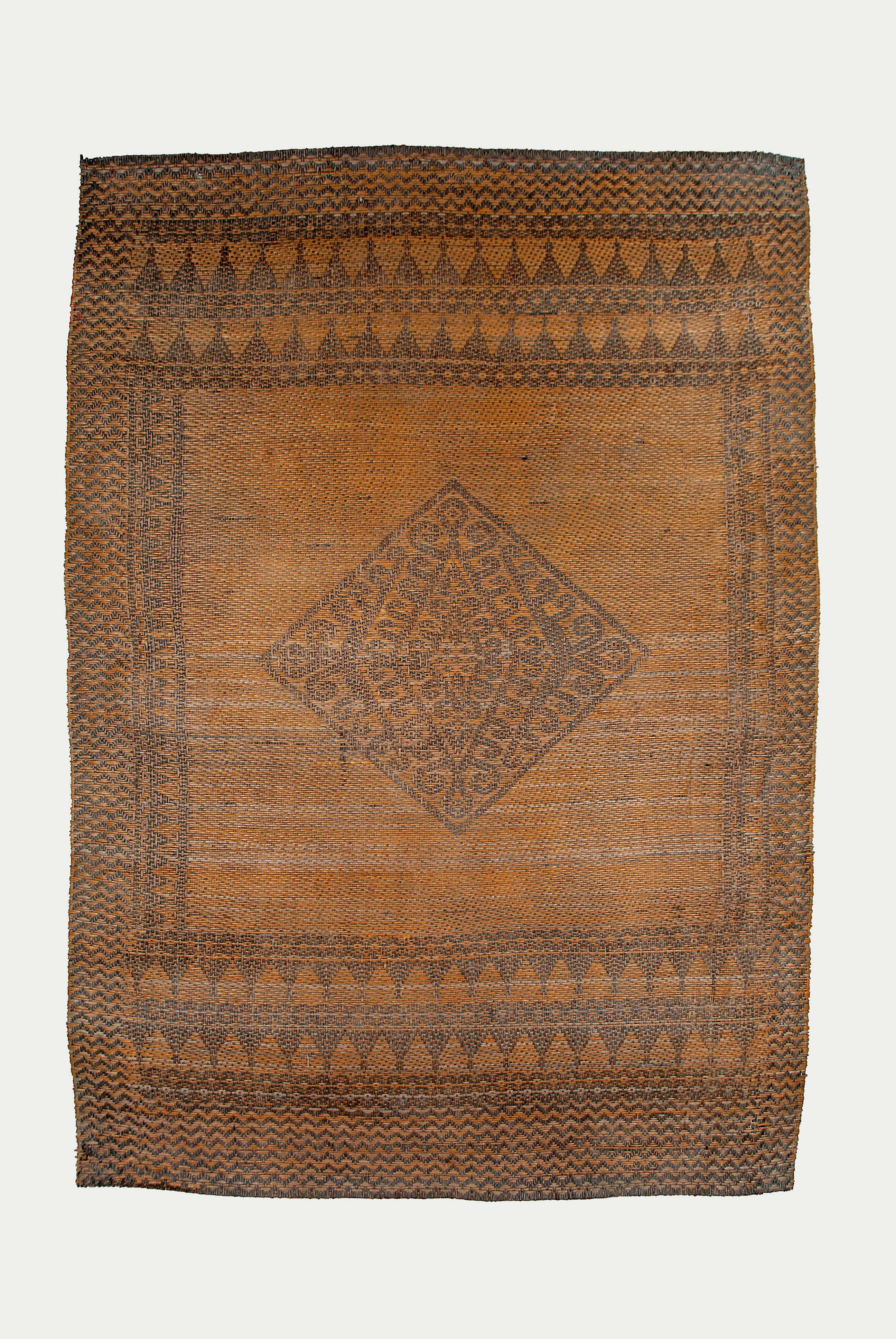 Antique Tribal Dayak Plaited Rattan Longhouse Mat (Tikar), Kalimantan

A fine old Dayak (Kebahan) rattan mat from the upper Kayan River area in the Melawi region of West Kalimantan. The orthogonal plait work of these mats are distinct from other