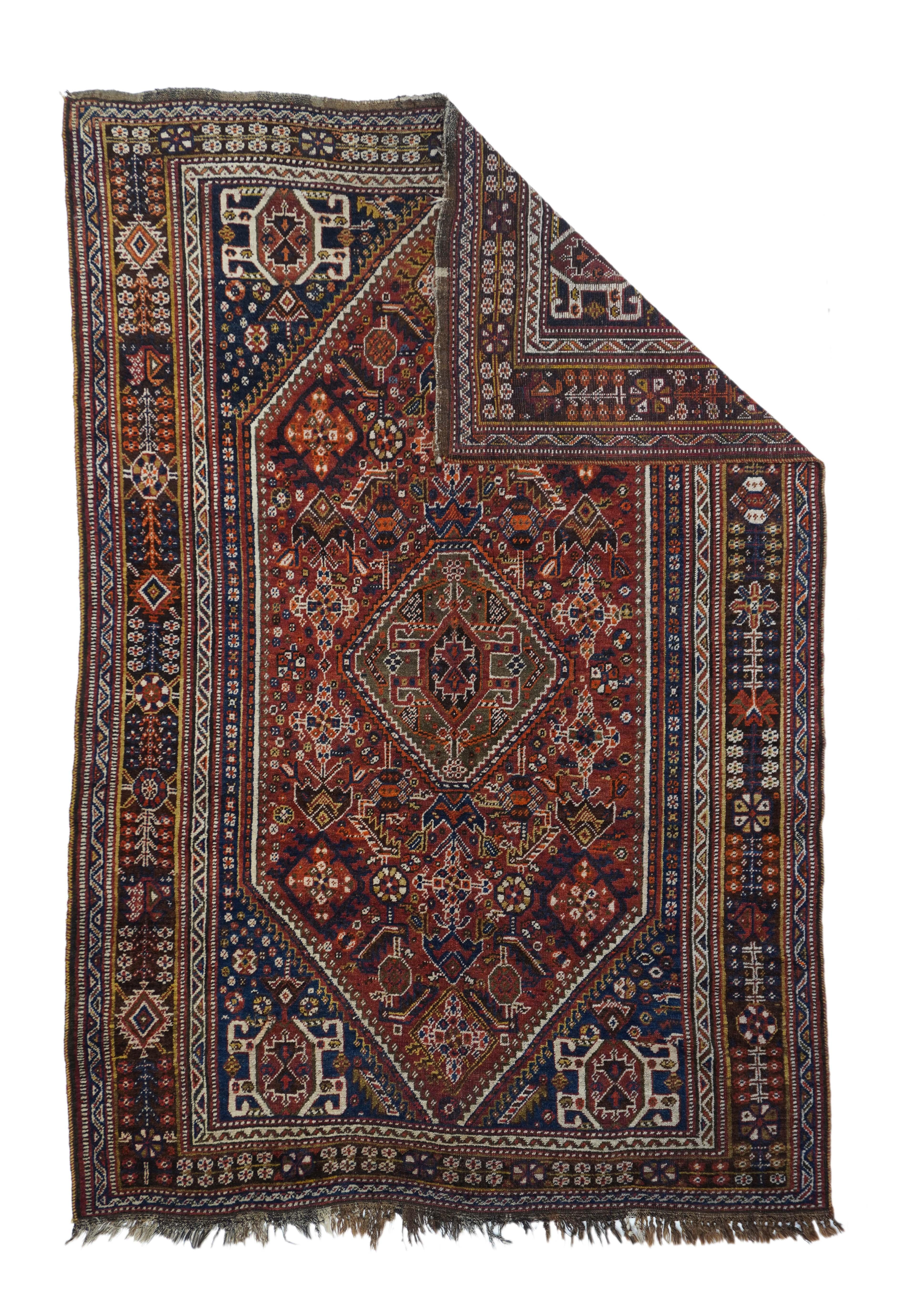 Antique Tribal Ghashgai rug 5'5'' x 8'6''. This moderately woven southwest Persian nomadic large scatter presents a very dark blue field with stylized 