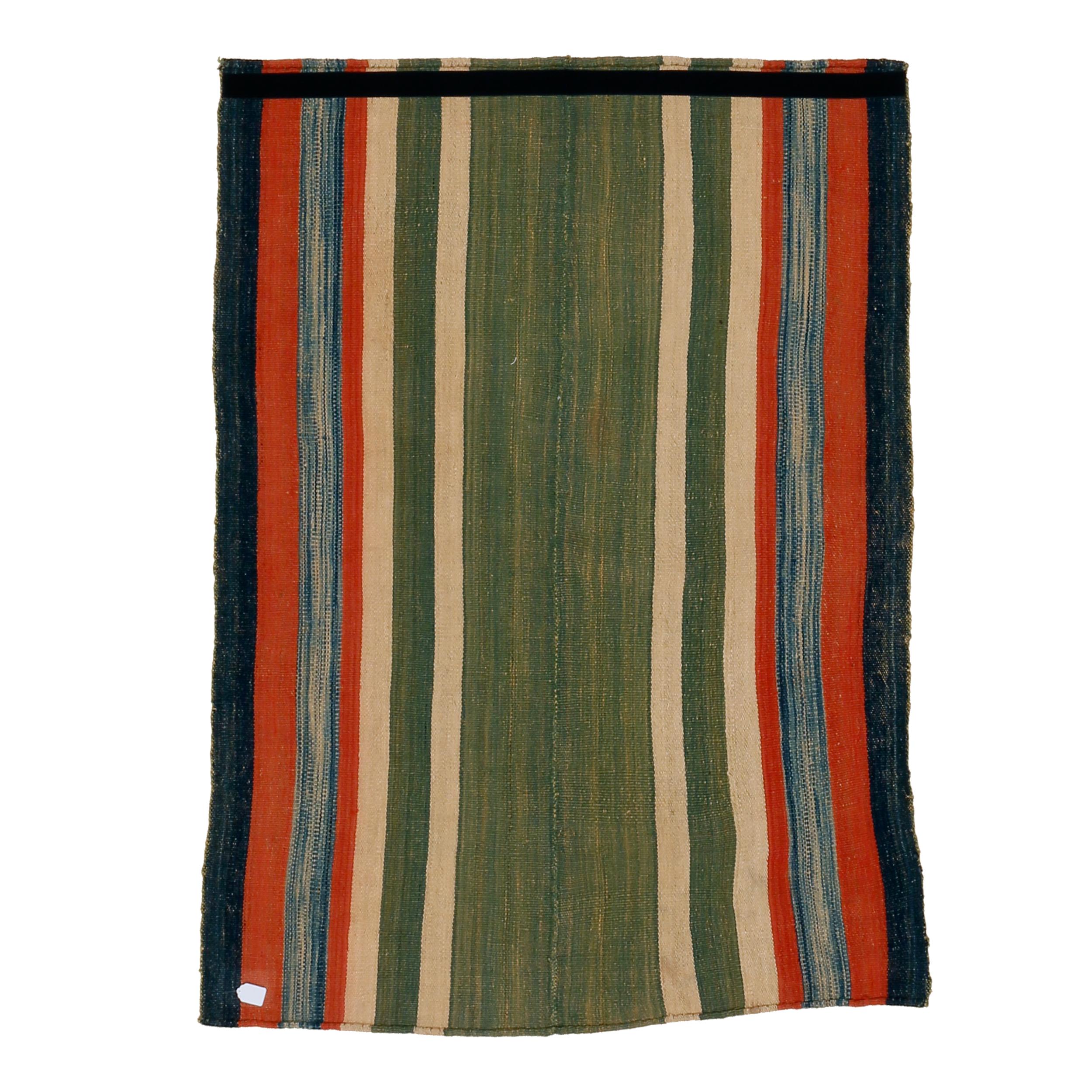 A very graphic tribal kilim composed of two joined panels each containing an array of polychrome vertical stripes of various widths. The result is a wool flat-weave with a mirror image pattern having a central stripe that is considerably wider than