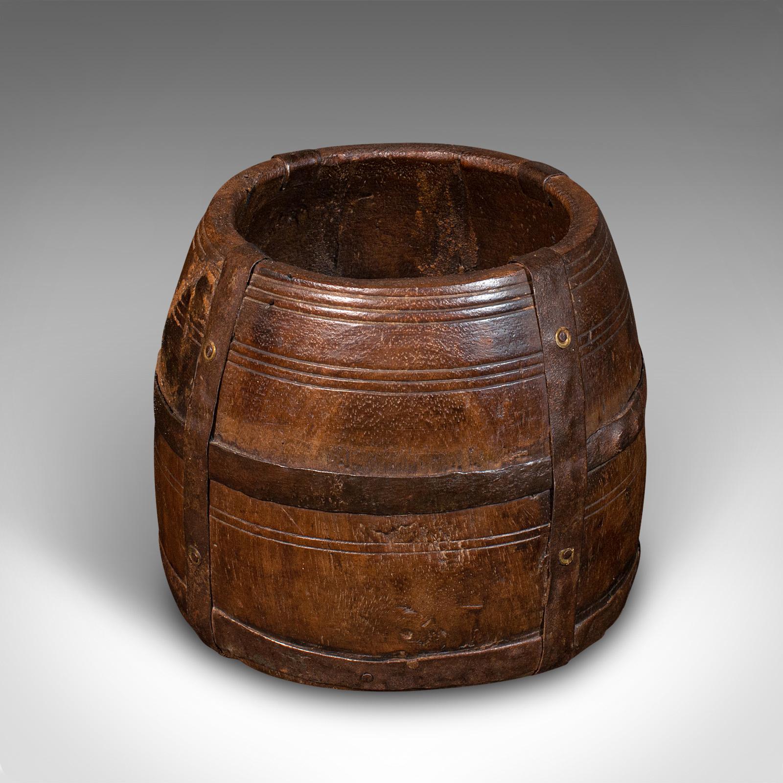This is an antique tribal jardiniere. An African, ironwood and cast iron bound decorative bowl, dating to the late Victorian period, circa 1900.

Wonderfully naive tribal craftsmanship and appearance
Displays a desirable aged patina
