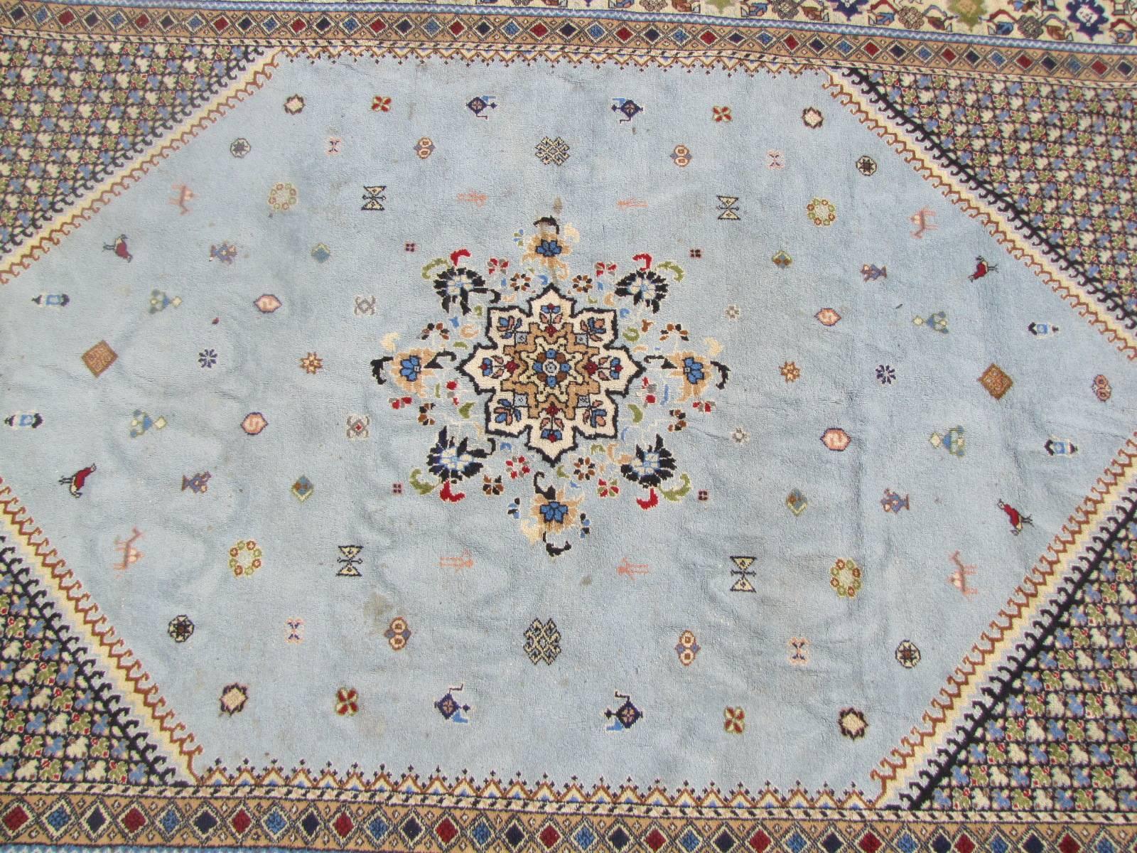A beautiful midcentury Moroccan Rabat rug with a beautiful geometrical tribal design and blue sky field color, entirely hand knotted with wool velvet on wool foundation.

 