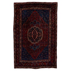 Tapis persan tribal ancien Bidjar, tons sombres et riches, vers les années 1930