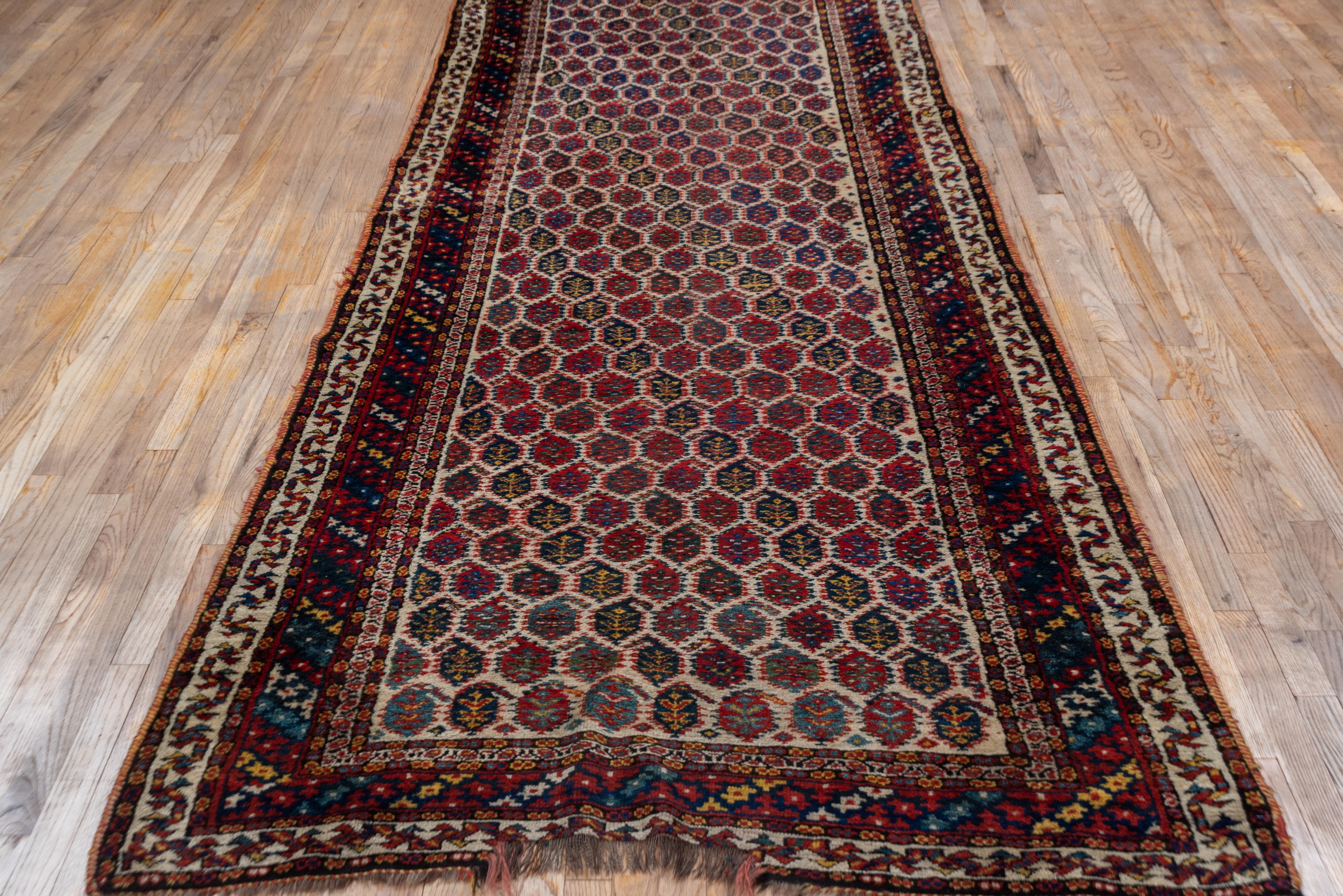 Antique Tribal Persian Kurd Runner, circa 1900s, All-Over Field, Medium Pile In Good Condition For Sale In New York, NY