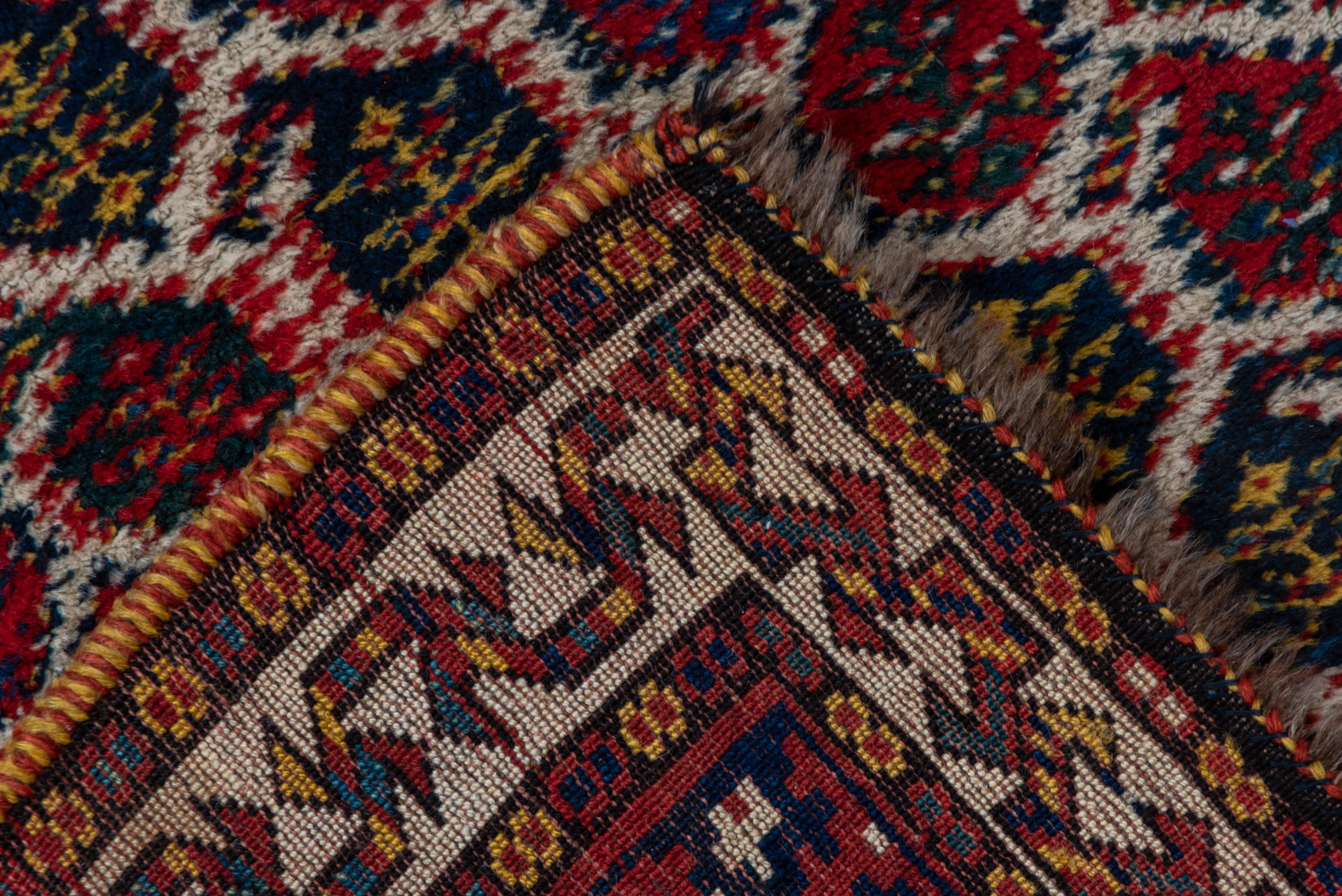 Wool Antique Tribal Persian Kurd Runner, circa 1900s, All-Over Field, Medium Pile For Sale