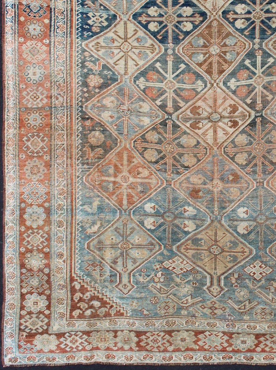 Unique Tribal geometric design antique Qashqai Persian rug in peach, maroon, red, gray, rug ema-7559, country of origin / type: Iran / Qashqai, circa 1910.

The Qashqai nomads are found in the Fars province in southwest Iran. They move twice a