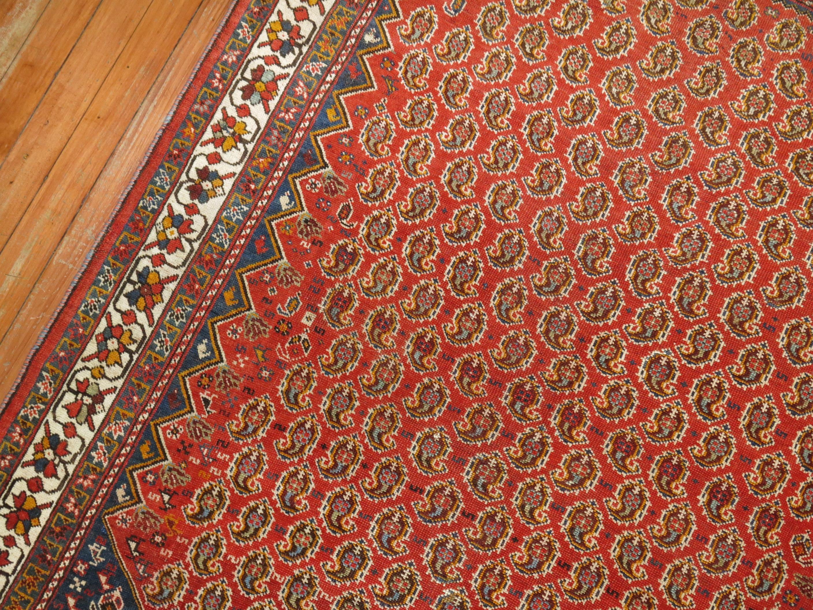 Antique Tribal Persian Rug, Red Ground, Blue Corner, Ivory Border In Good Condition For Sale In New York, NY