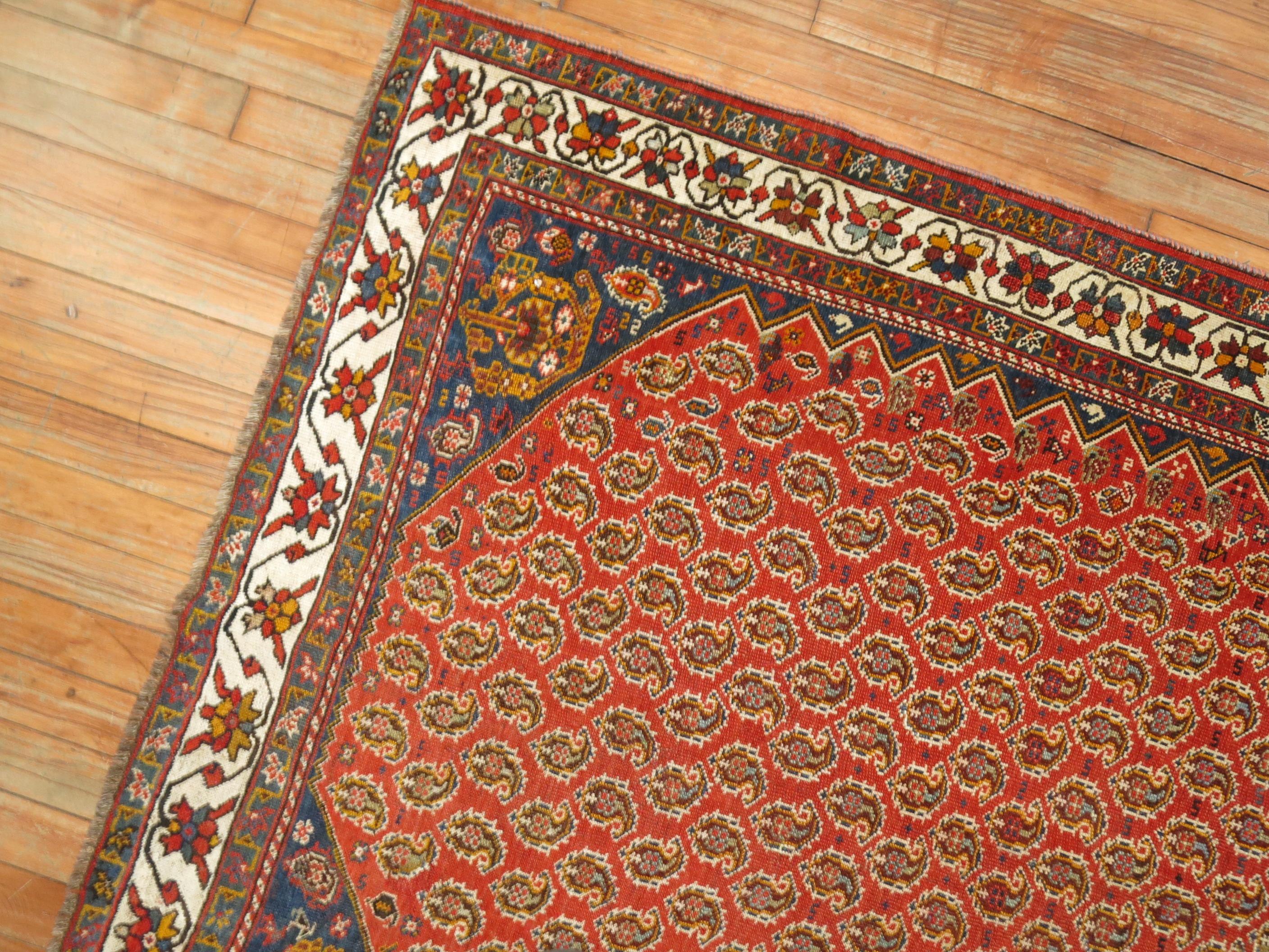 Wool Antique Tribal Persian Rug, Red Ground, Blue Corner, Ivory Border For Sale