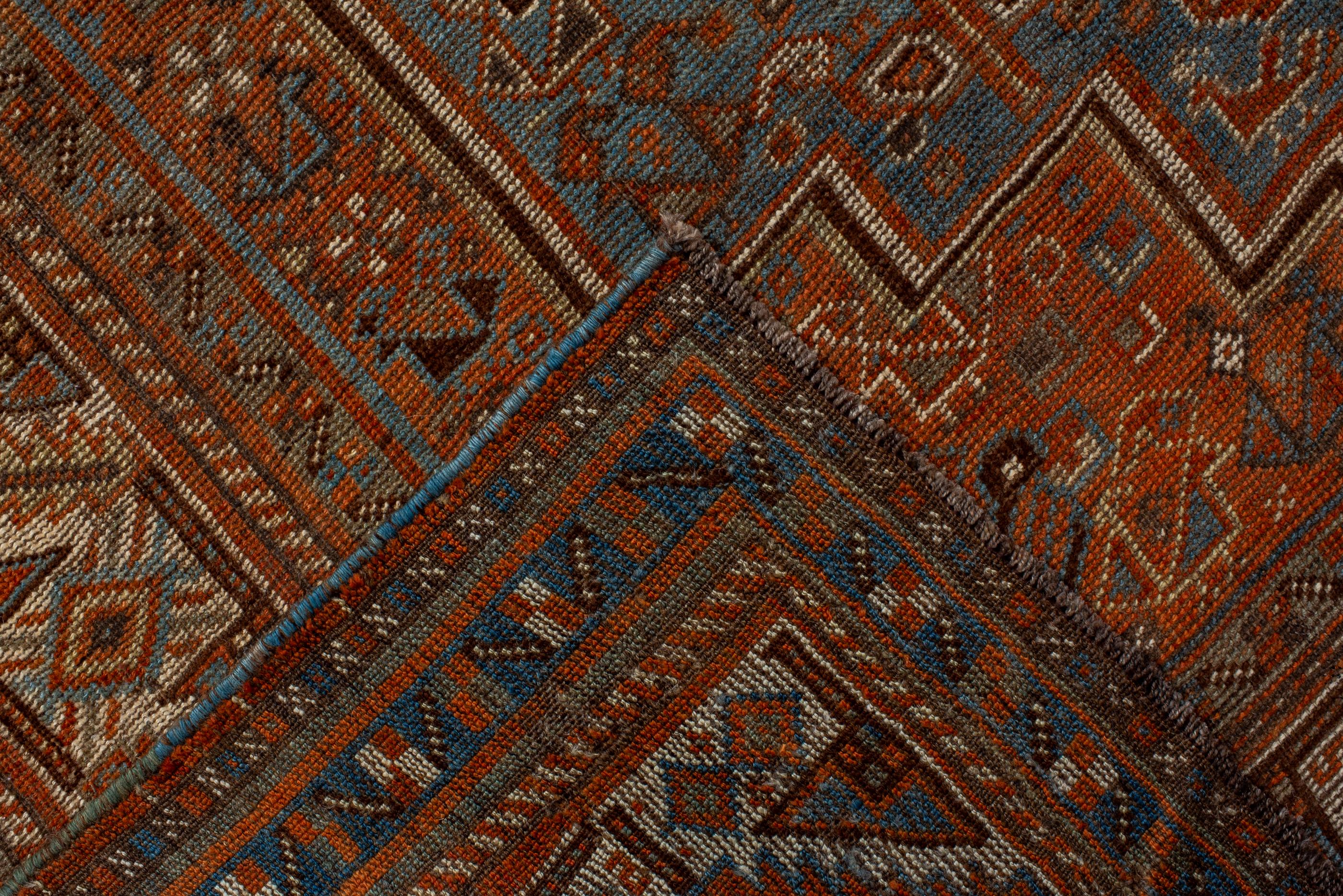 20th Century Antique Tribal Shiraz with Light Blue Field and Rosette Border