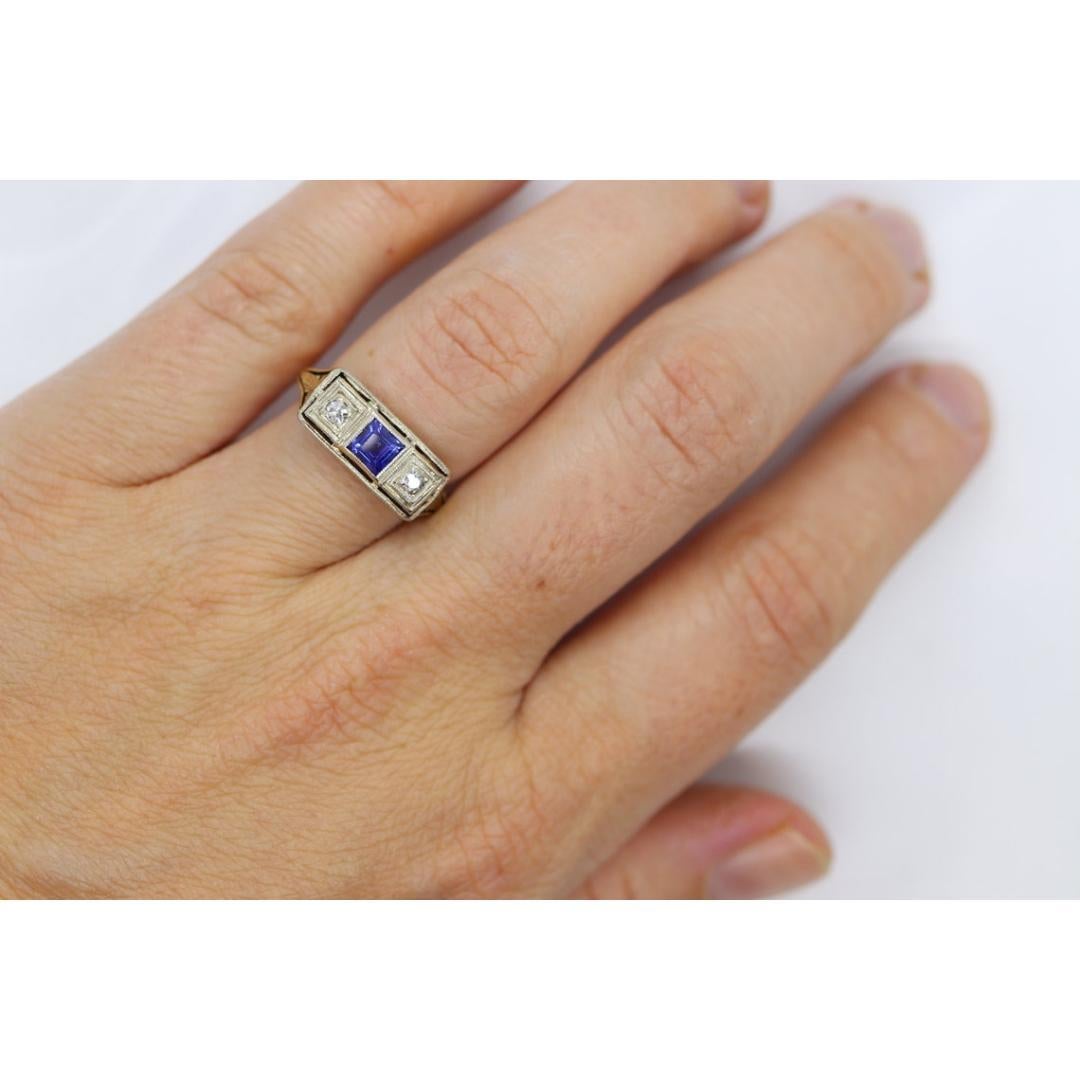 Vintage from the 1930s
Materials: Gold
Gemstone: Diamond
Gem Color: Colorless
Band Color: Gold

Style: Art Deco

Very beautiful Art Deco diamond and sapphire ring. Filigree open design shield with Three gems. Princess sapphire set into the middle