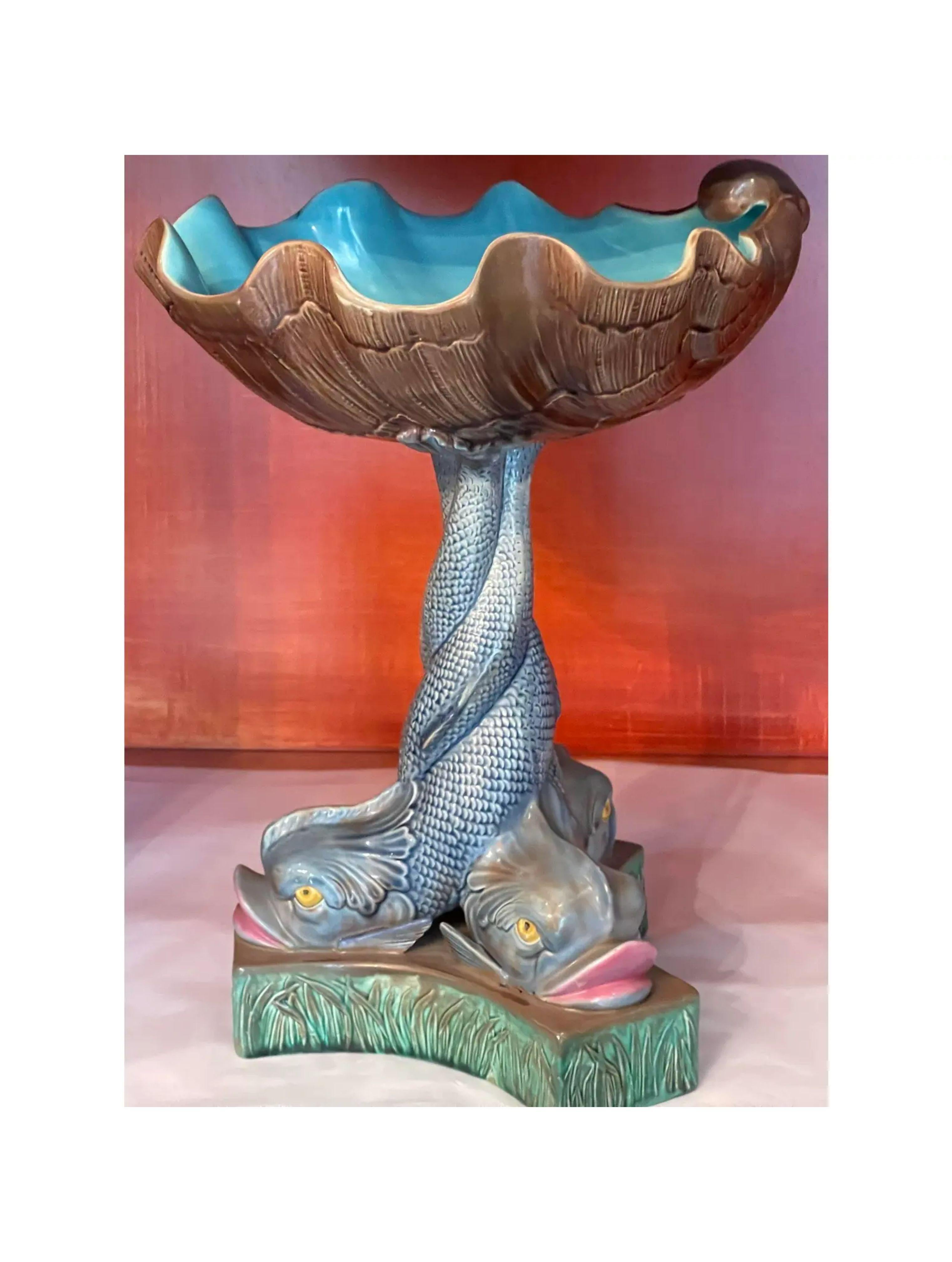 Rare antique triple Dolphin Majolica pottery centerpiece bowl. A rare example dating to the 19th century with three dolphins around the base and a shell form bowl on top.

Additional information:
Materials: Pottery
Color: Blue
Period: 19th