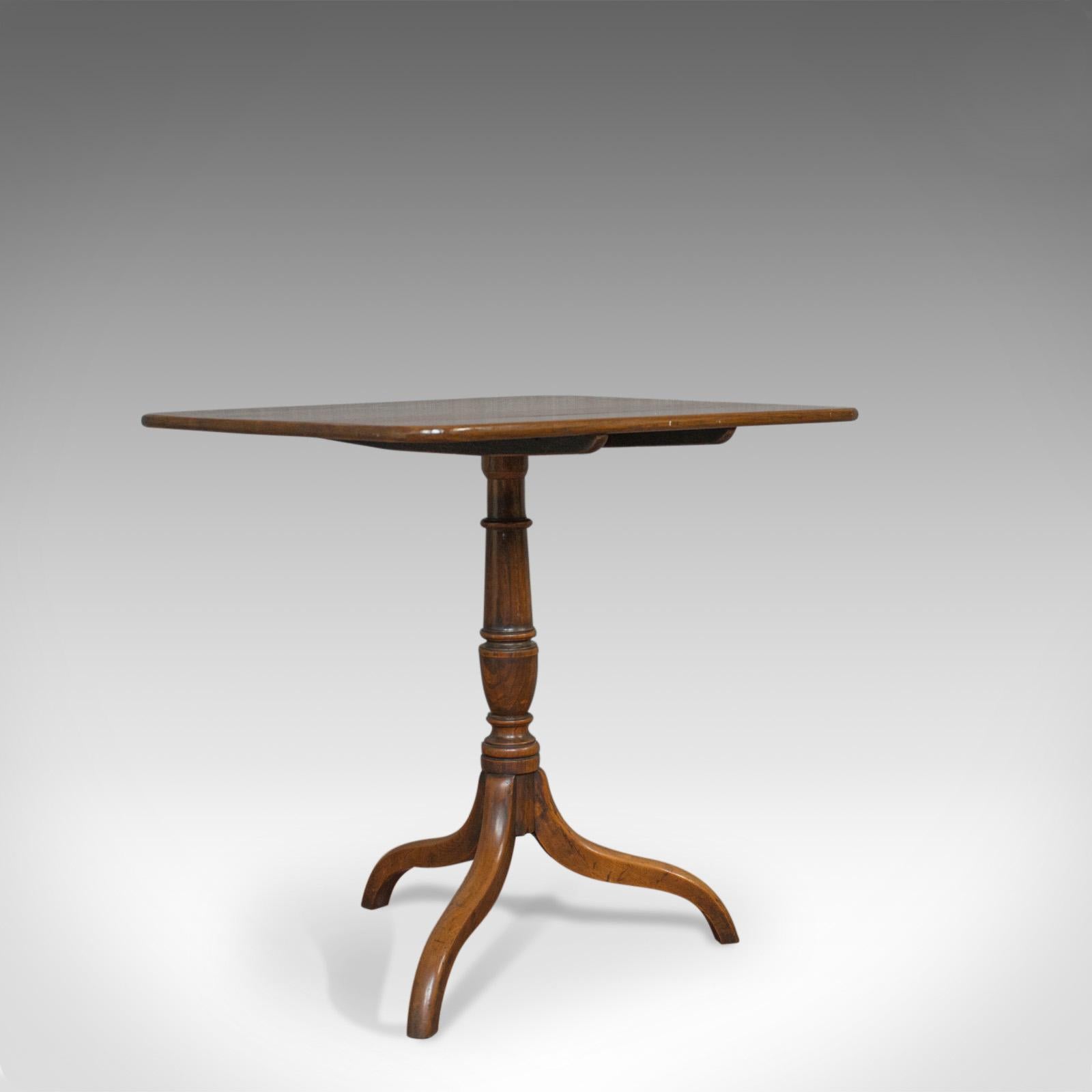 This is an antique tripod table. An English, Regency, tilt-top oak side table dating to the early 19th century, circa 1830.

Displays good consistent colour and a desirable aged patina
Select oak shows attractive grain interest and wisps of