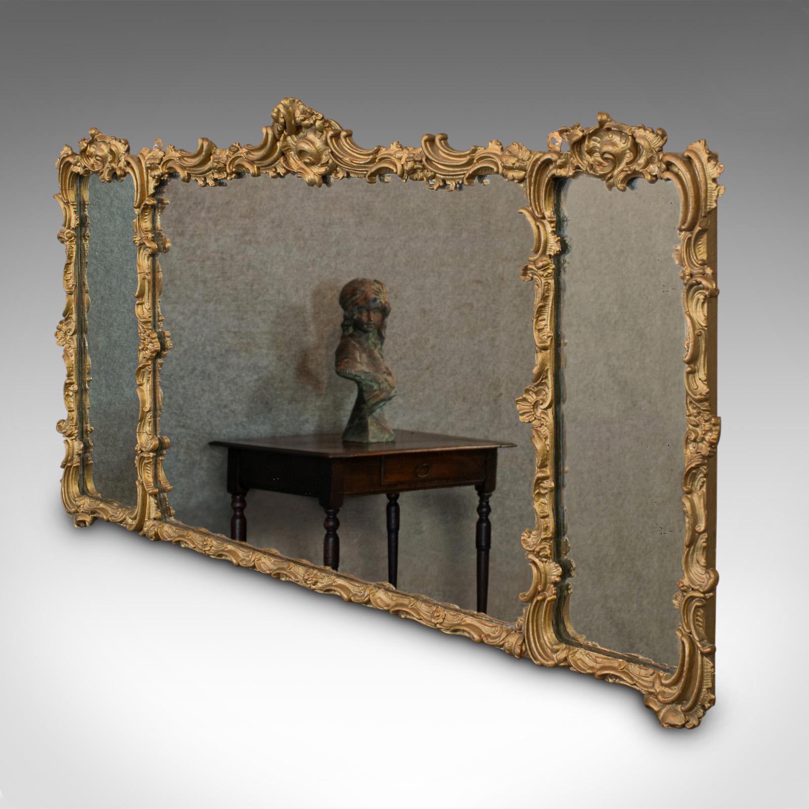This is an antique triptych mirror. An Italian, gilt gesso overmantle hanging mirror, dating to the mid 19th century, circa 1850.

Generously sized, attractive mirror
Displays a desirable aged patina
Radiant gilt gesso in very good