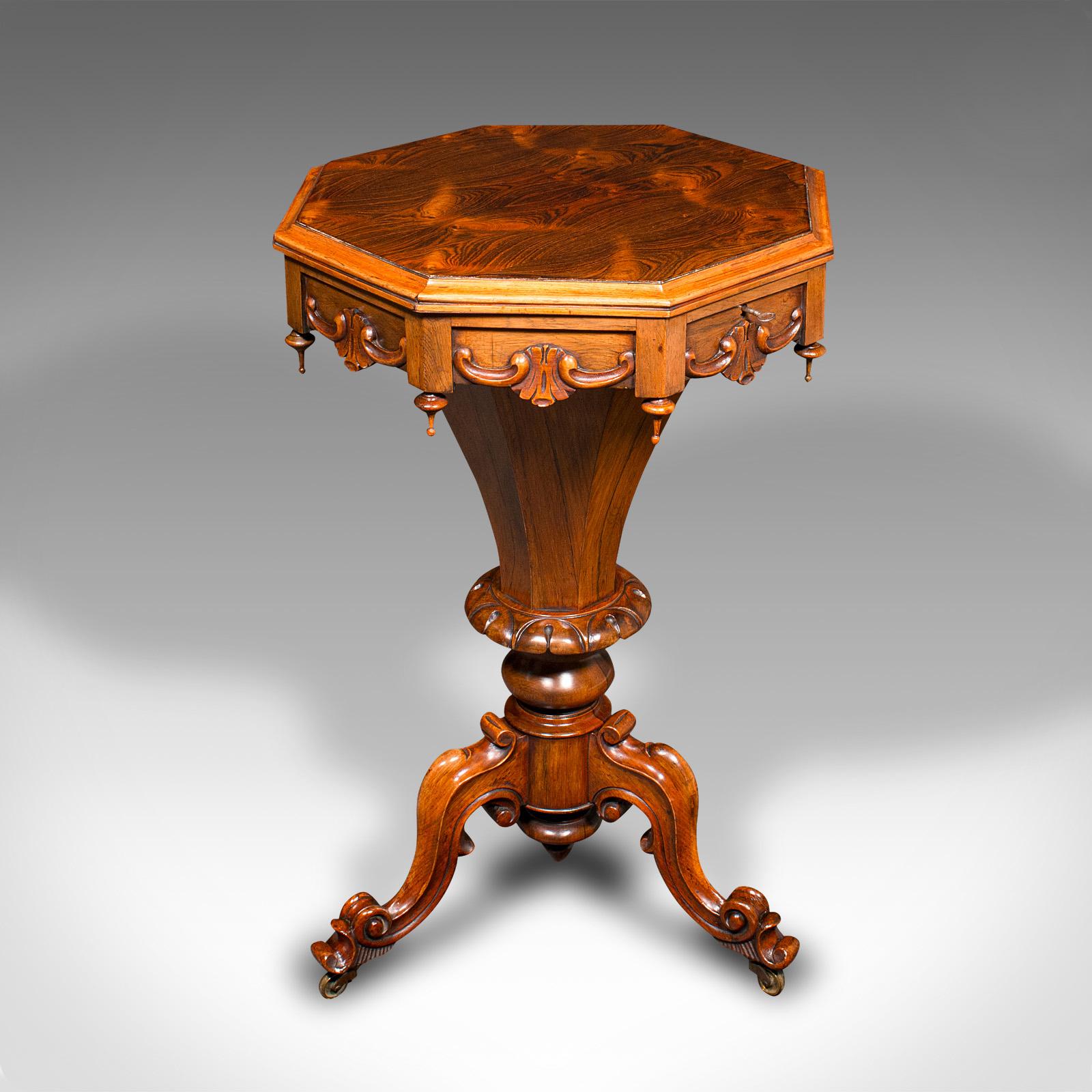 This is an antique trumpet sewing table. An English, rosewood ladies work table, dating to the early Victorian period, circa 1840.

Striking example with a fine appearance and vibrant interior finish
Displaying a desirable aged patina and in very
