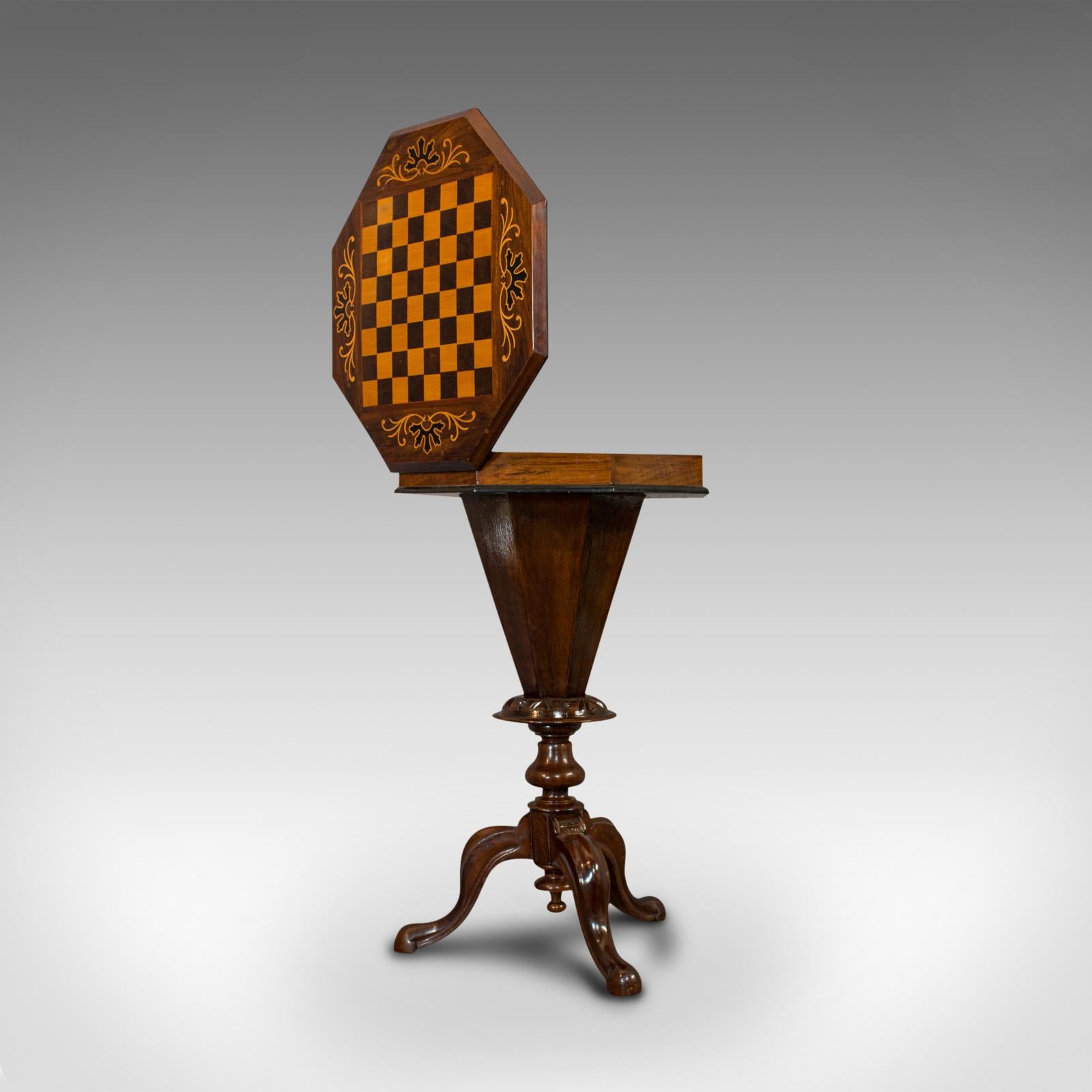 This is an antique trumpet shaped games table. An English, walnut chess board or sewing table, dating to the Victorian period, circa 1890.

Fascinating trumpet form
Displays a desirable aged patina
Select walnut shows fine grain interest and