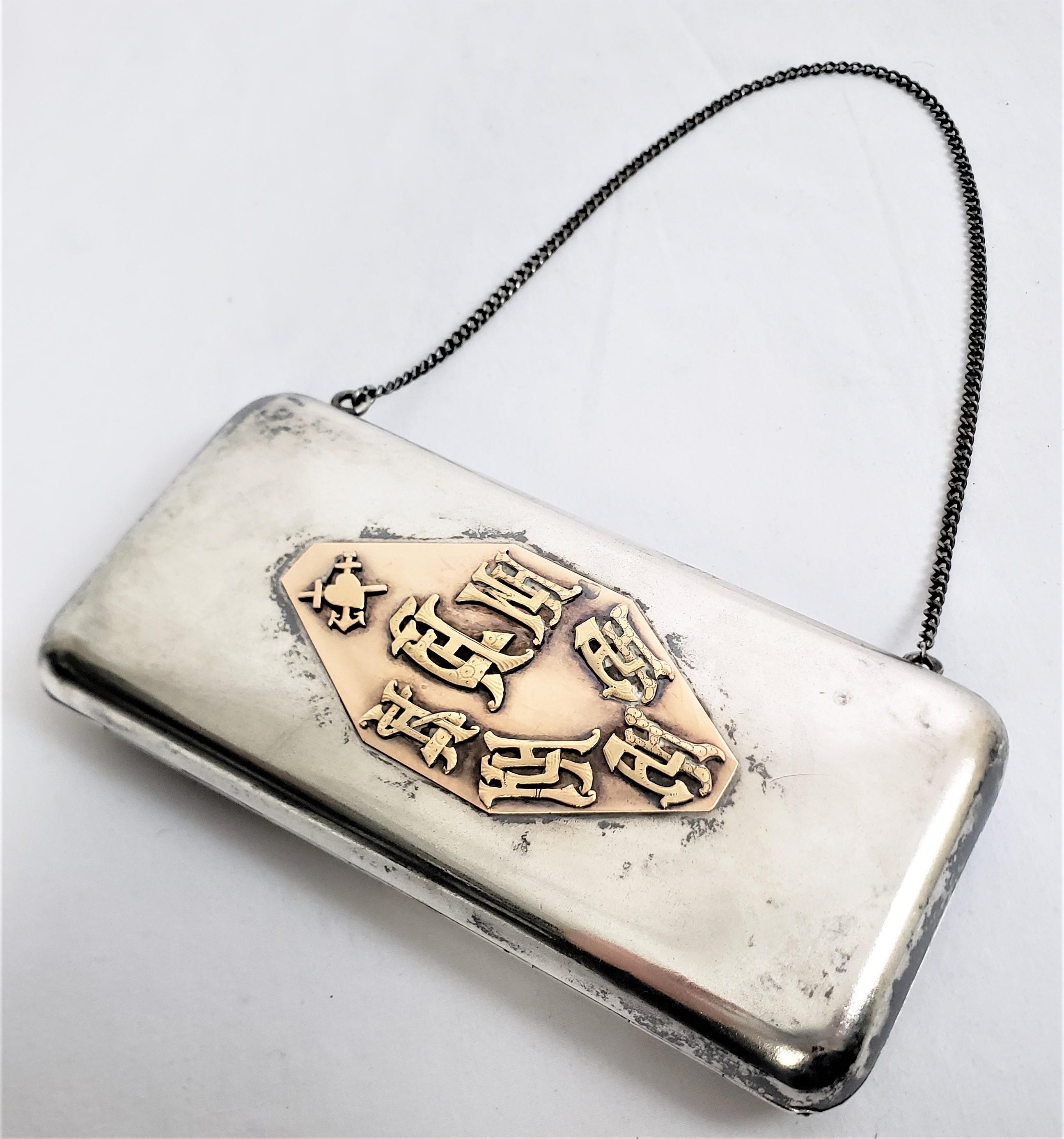 This antique ladies clutch purse or evening case is unsigned, but presumed to have originated from Tsarist Russia and date to approximately 1900 and done in their ttraditional Imperialist style. The case itself and chain are composed of 840 silver