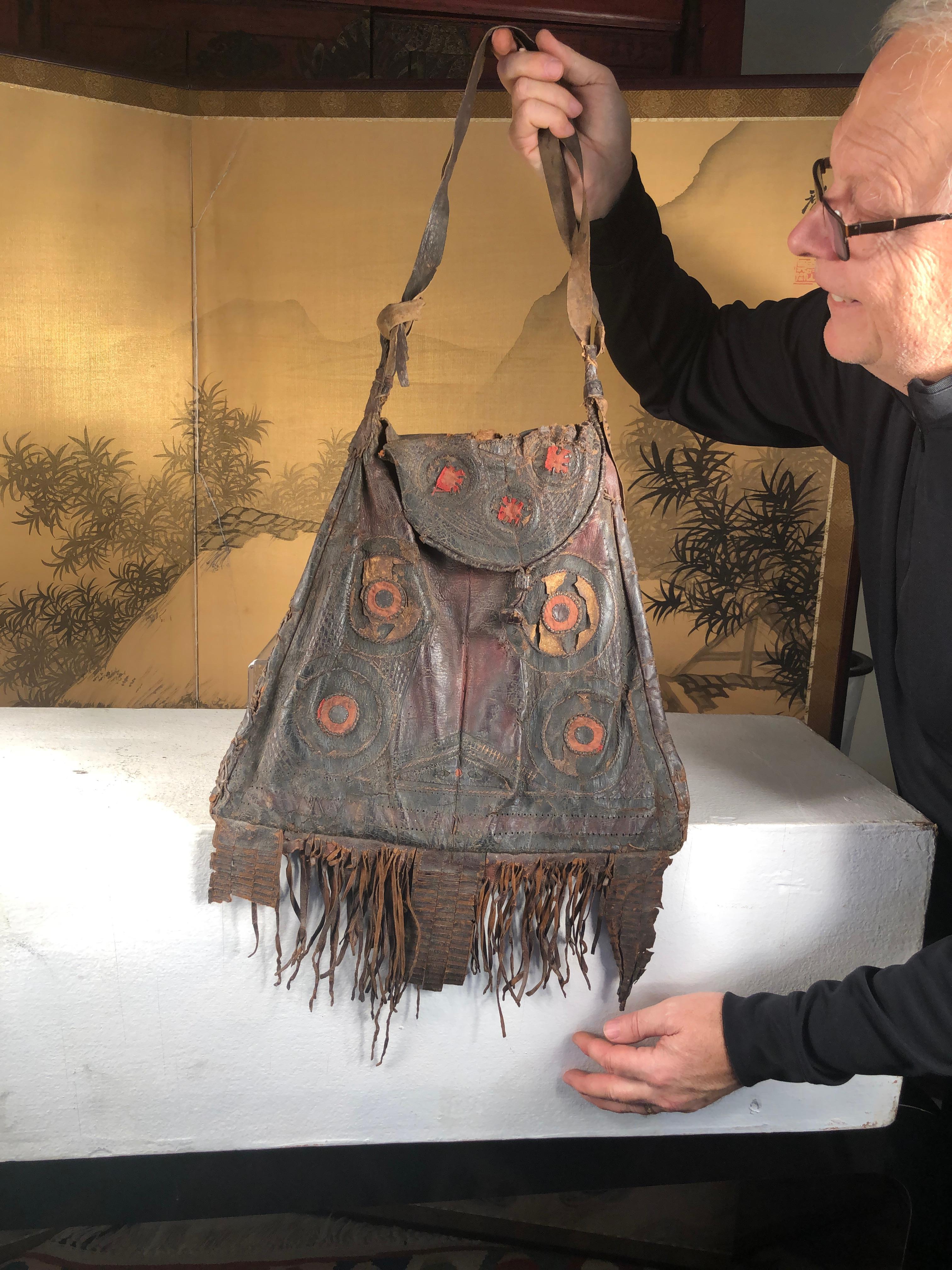 Originally collected in eastern Africa, than traded into Morocco, this Tuareg Berber Tribe leather bag with 