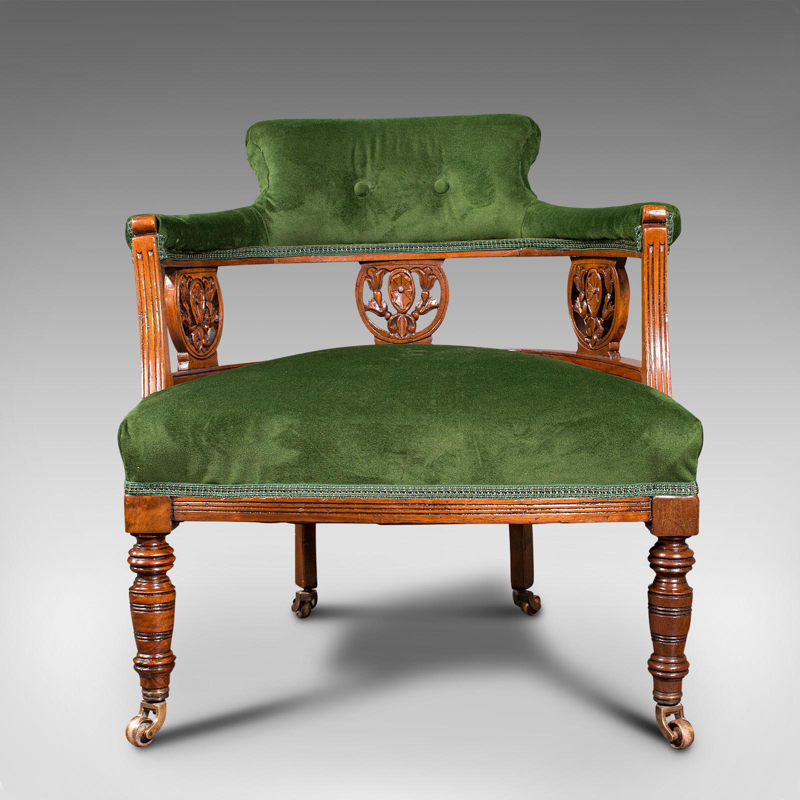 This is an antique tub chair. An English, velvet over mahogany elbow chair, dating to the Edwardian period, circa 1910.

Eye-catching colour and pleasingly diminutive in form
Displays a desirable aged patina throughout
Benefits from a recent