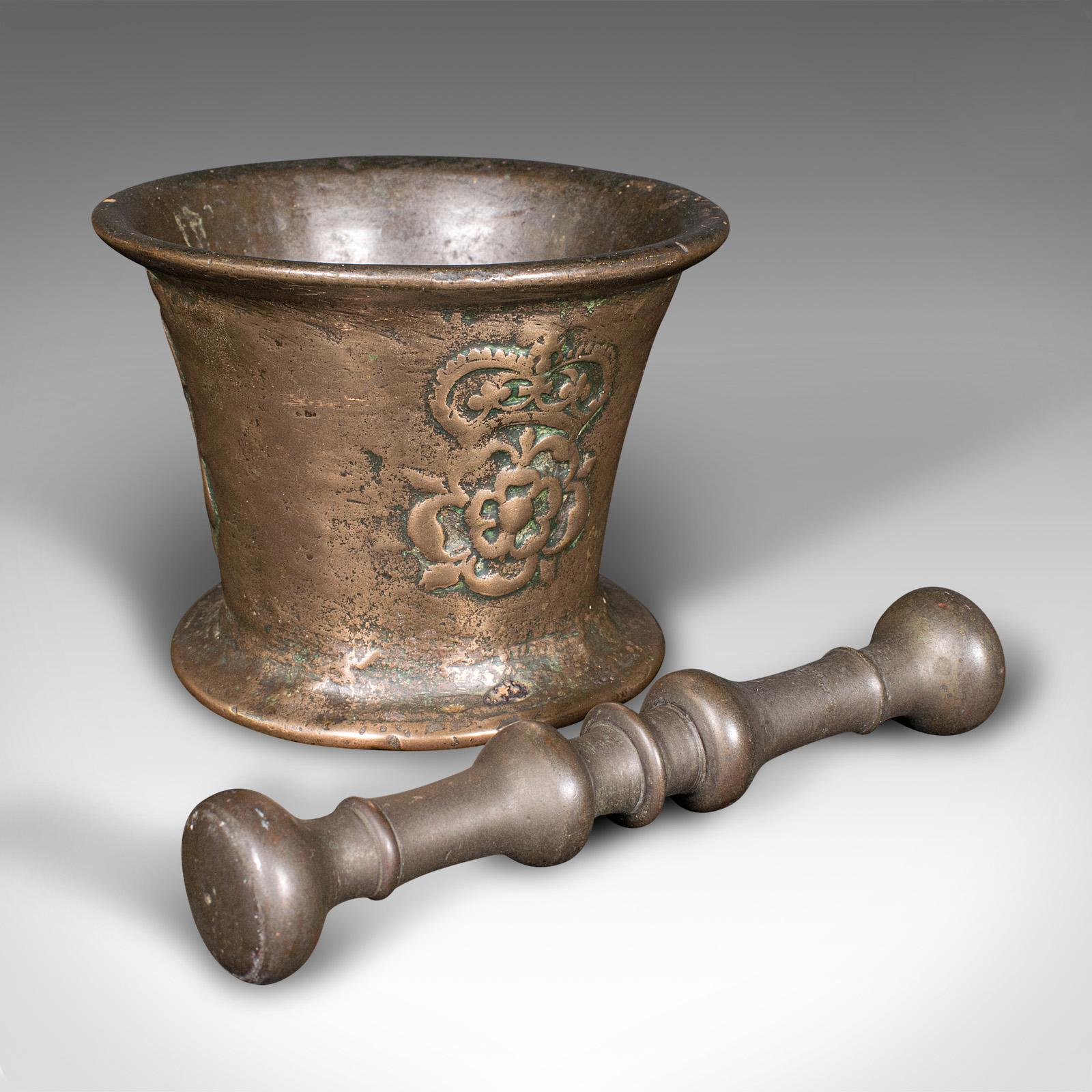 This is an antique Tudor Rose mortar and pestle. An English, bronze apothecary instrument, dating to the mid 17th century, circa 1650.

Accessorise your counter tops with this delightful mortar & pestle
Displays a desirable aged patina and in good
