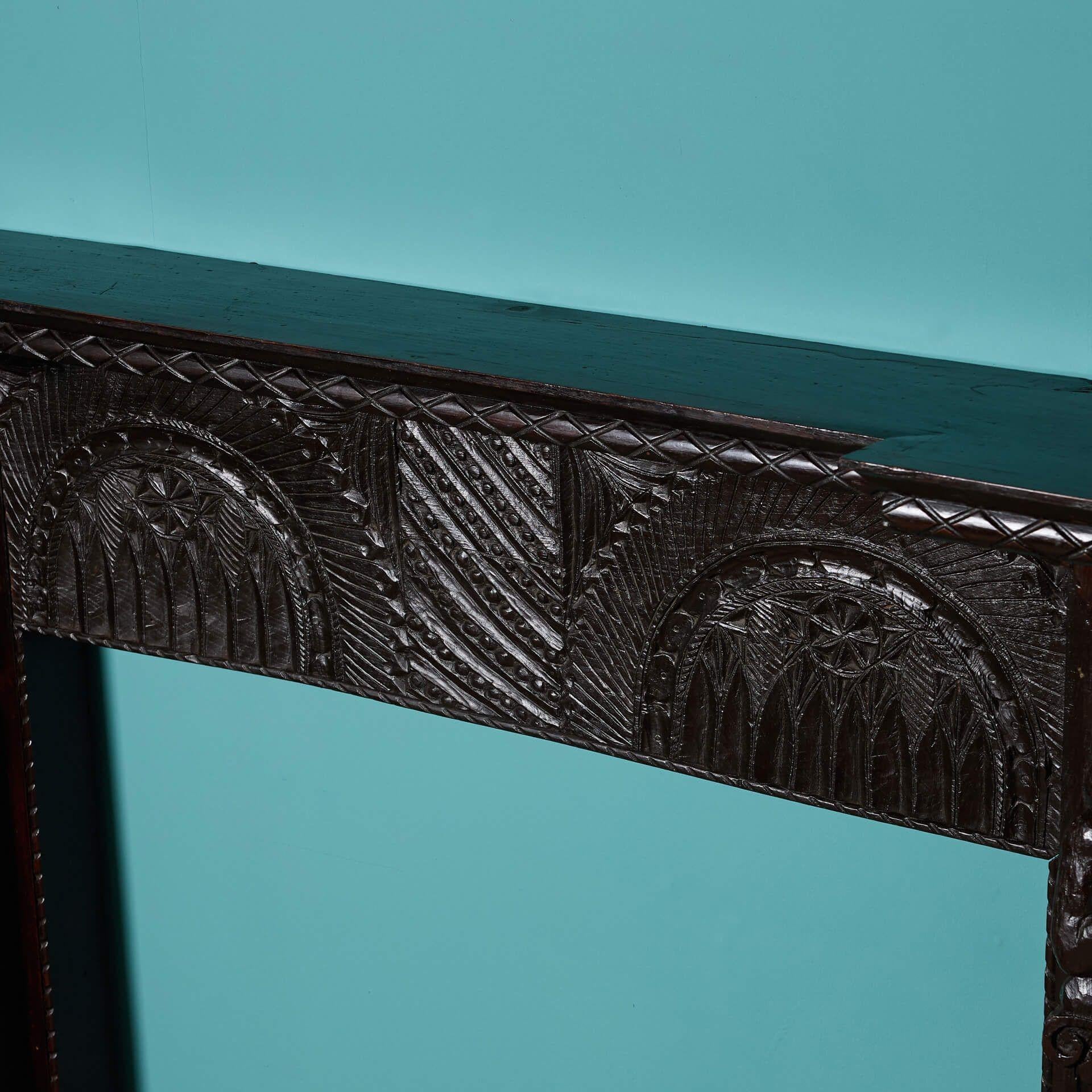 Wood Antique Tudor Style Carved Oak Fireplace For Sale