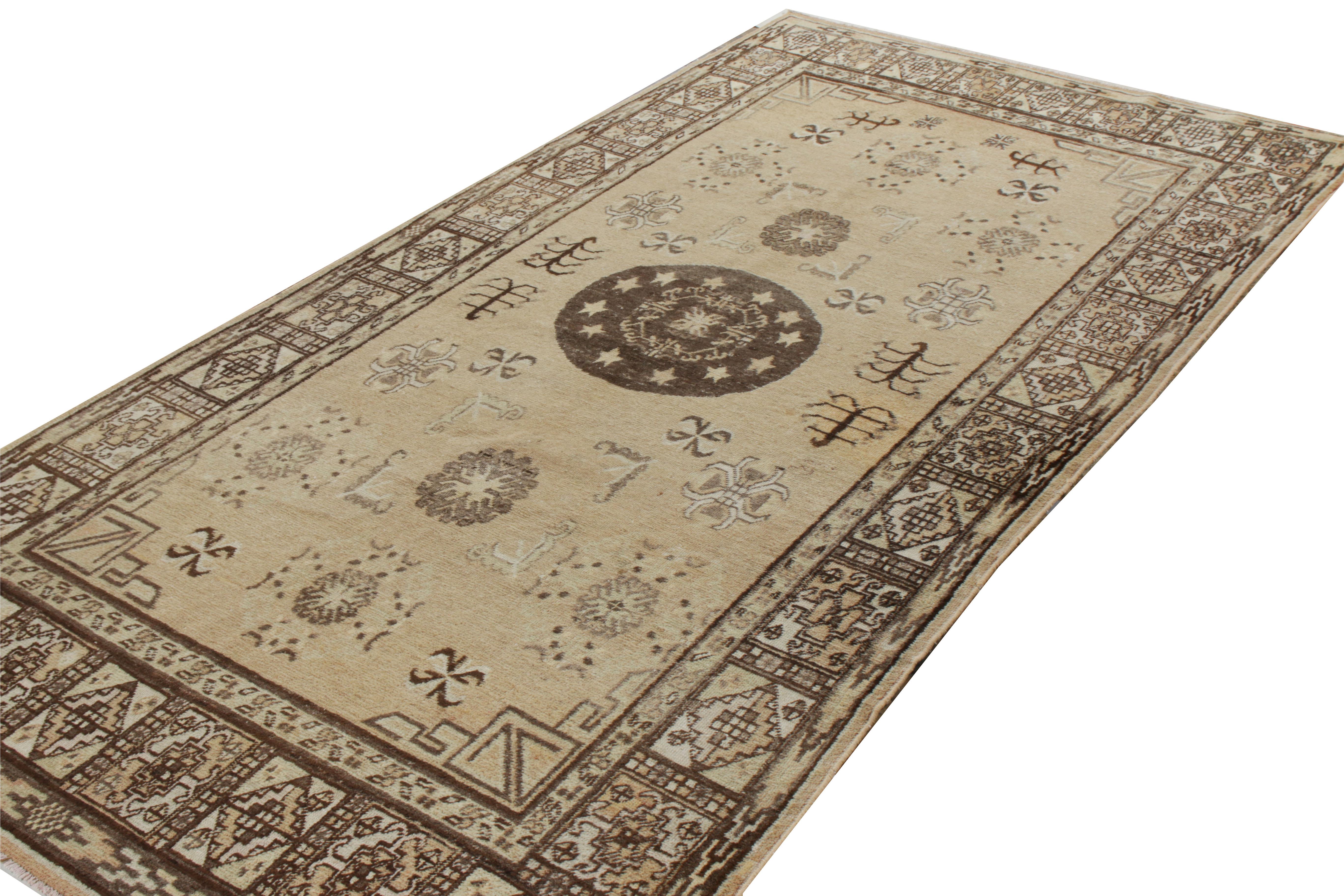 Originating from Turkestan circa 1920-1930, this antique Khotan rug s a features a medallion pattern that stands secured in an all over geometric design accompanied with elegant flowers scattered on the scale. The 6x11 masterpiece revels on a