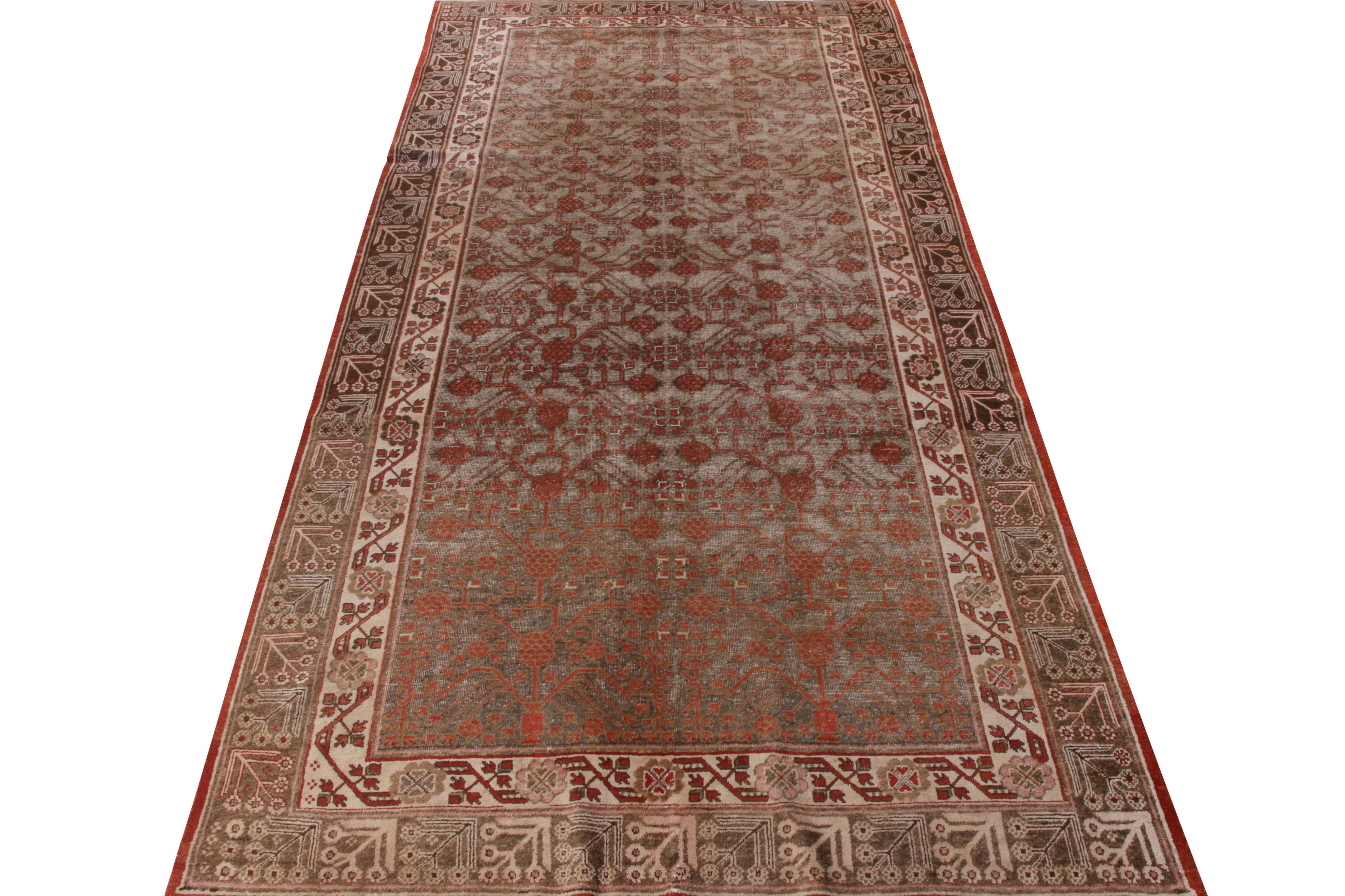 Hand knotted in quality wool, this antique 6x12 Khotan rug originates from East Turkestan circa 1920-1930. Bearing the fine design sensibilities of the early 20th century, the runner features a gorgeous geometric pattern displaying an unprecedented