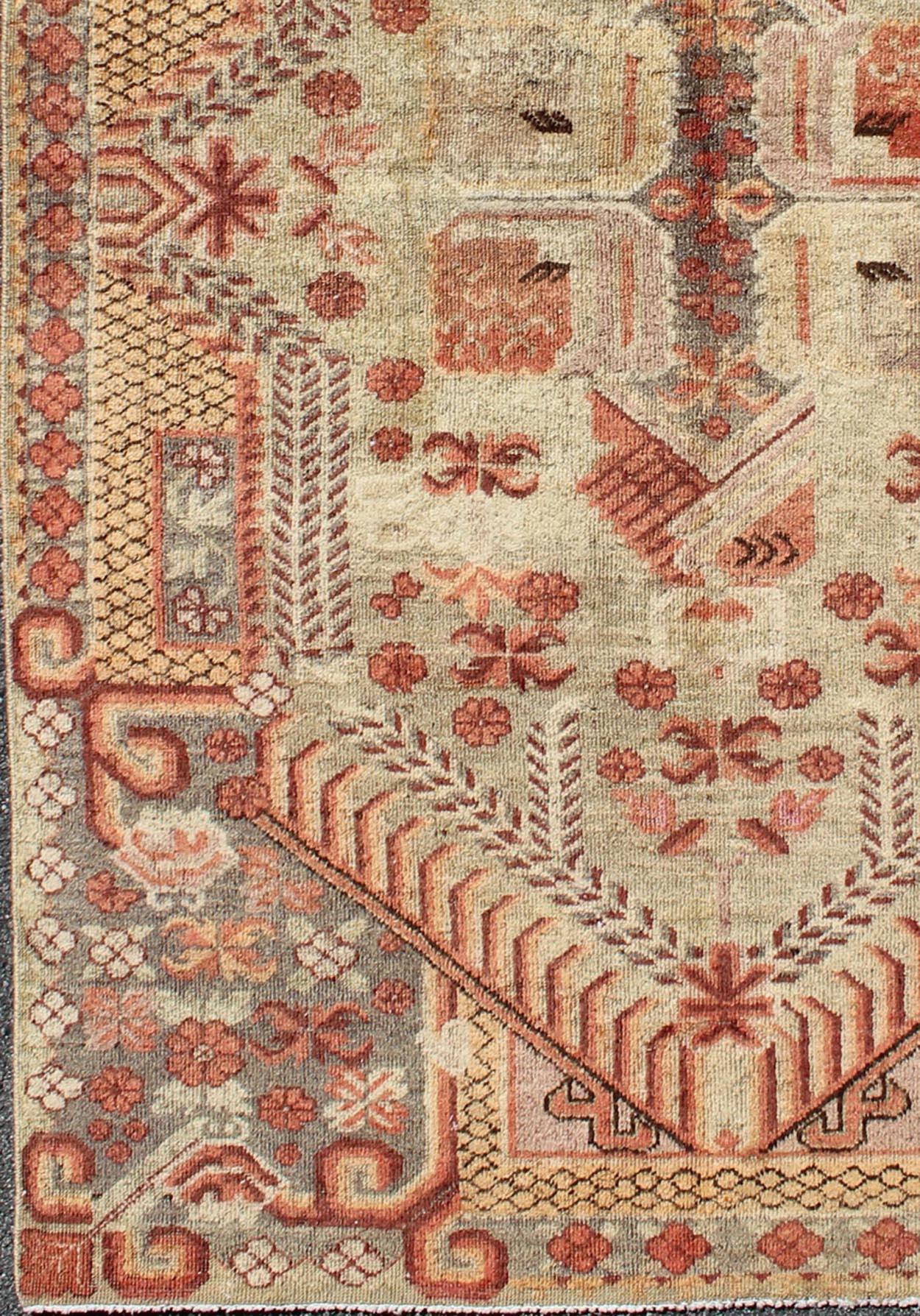 Khotan rug antique with bright coloration, rug mp-884-113550, country of origin / type: Turkestan / Khotan, circa 1930

This antique Khotan rug from Turkestan features a geometric tribal design that expands in intricate patterns throughout the