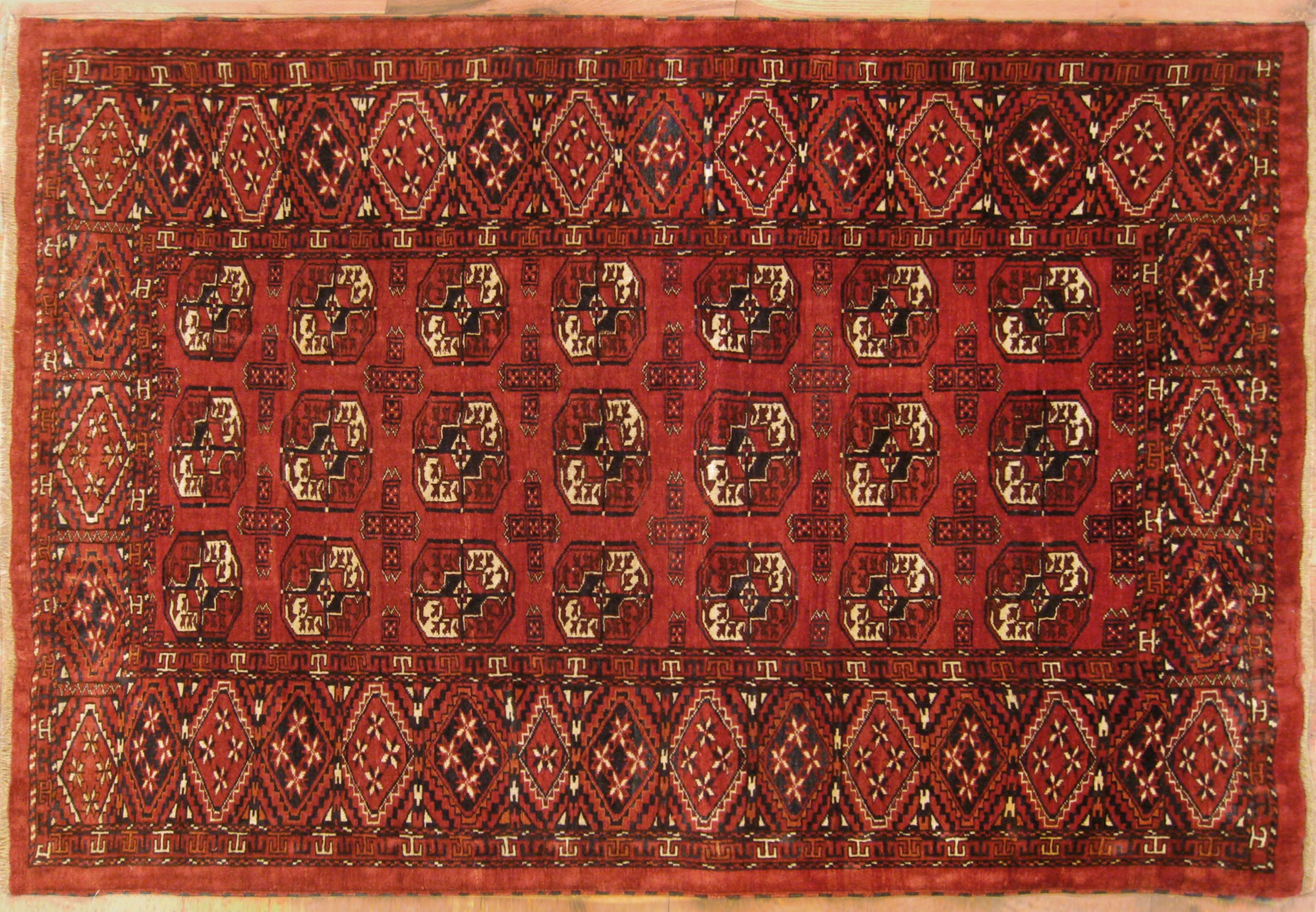 Antique Turkestan Turkman Rug, Small size, circa 1900

A one-of-a-kind antique Turkestan Turkman Oriental Carpet, hand-knotted with soft wool pile. This geometric carpet features a repeating design allover the red primary field, with a blue outer