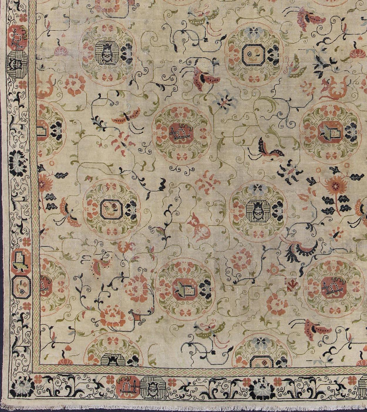 Antique Khotan rug with creamy ivory field and floral design, rug 18-0502, country of origin / type: Turkestan / Khotan, 1930

This attractive antique Khotan rug is a spectacular testament to the complexity of Turkestan design. The creamy ivory