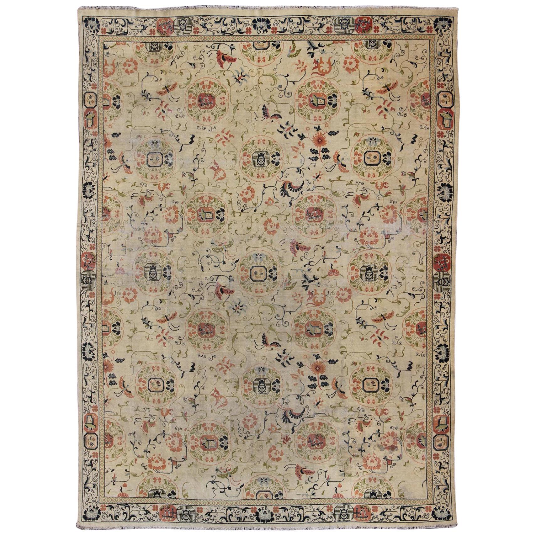 Antique Khotan Rug with  Ivory Field in navy blue, coral, ivory, green, and gray