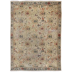 Antique Khotan Rug with  Ivory Field in navy blue, coral, ivory, green, and gray
