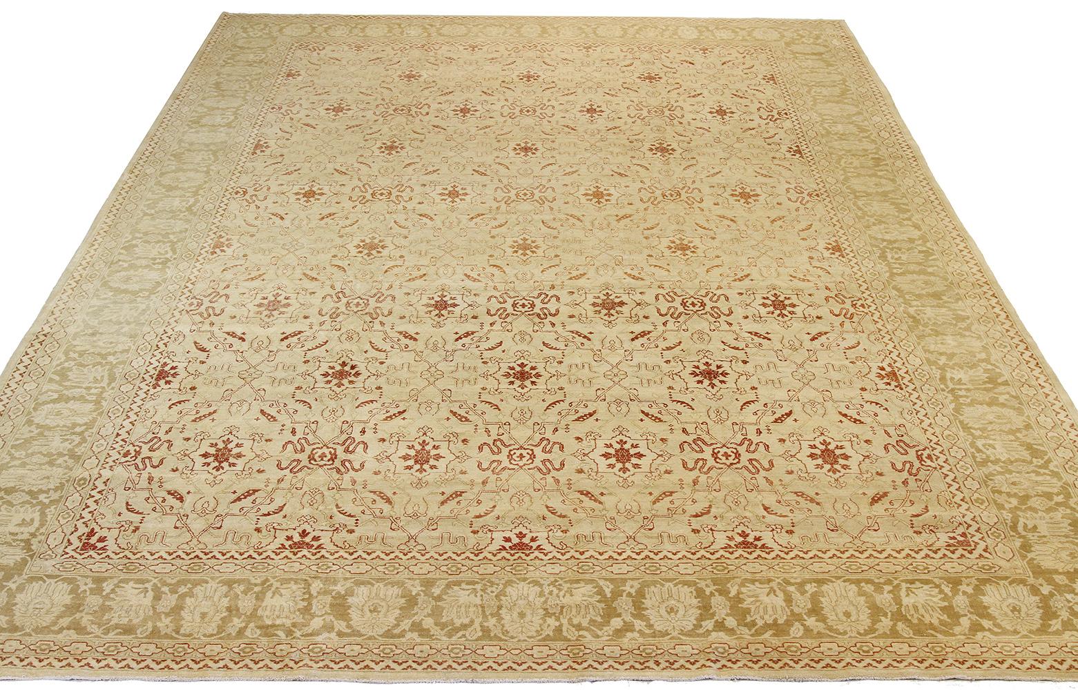 Antique Turkish rug handwoven from the finest sheep’s wool and colored with all-natural vegetable dyes that are safe for humans and pets. It’s a traditional Agra weaving design featuring botanical patterns in beige and brown on a plush ivory field.