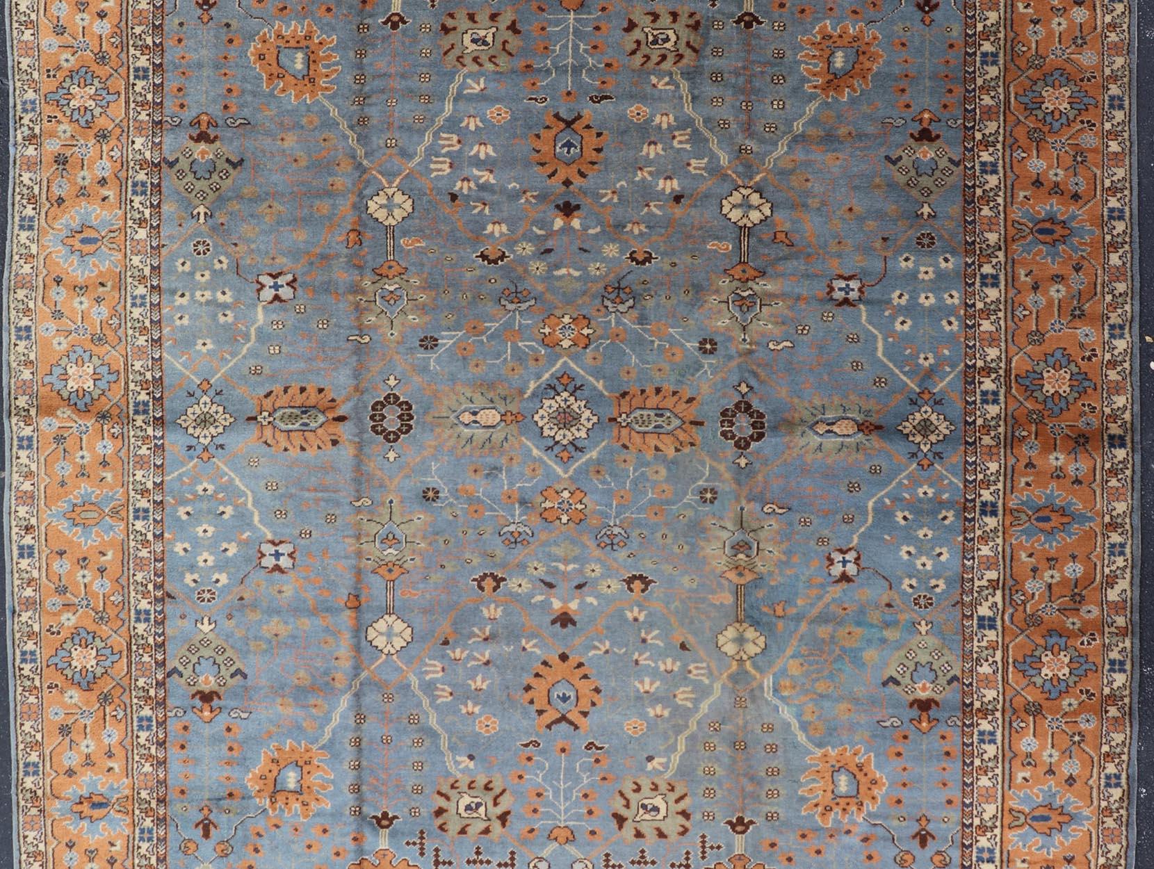 Hand-Knotted Antique Turkish All Over Oushak Rug in Blue Background by Keivan Woven Arts For Sale