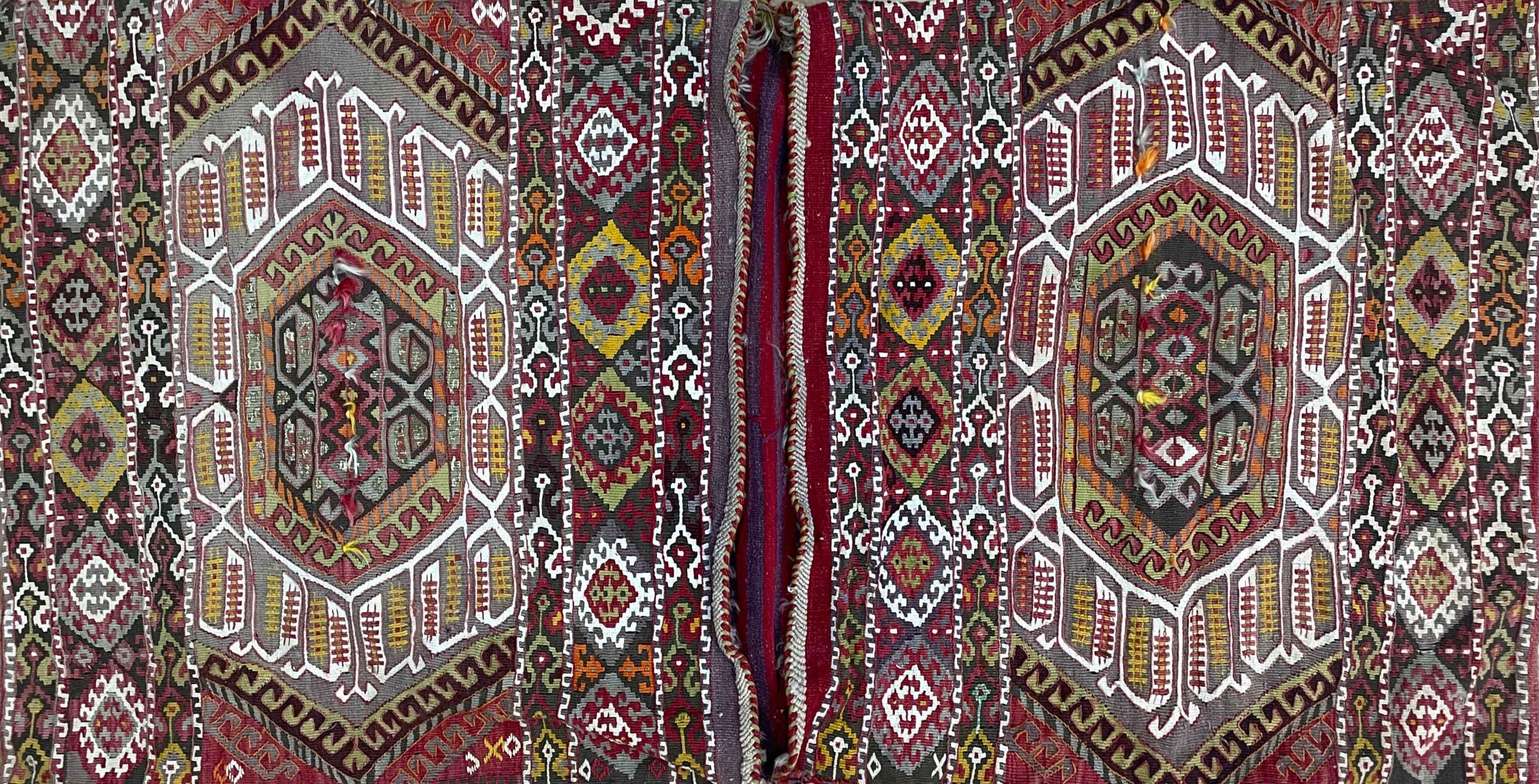 Antique Turkish Saddle bag made of  flat weave or kilim.
In the past used for transportation on camels.
It's a collector rug or a very nice decorative for your home.