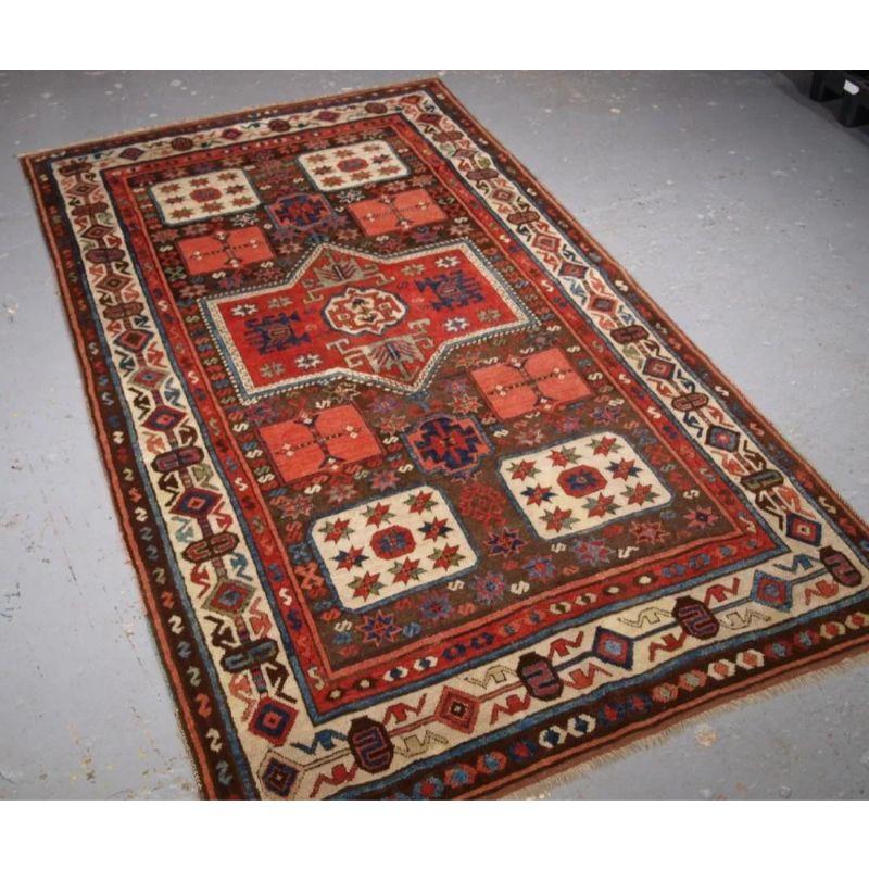 An antique South Eastern Anatolian Antep rug. This is a outstanding example of this scarce design which has many similarities to that found in Caucasian Karachov Kazak rugs, with the four corner boxes containing stars. The rug has a soft brown