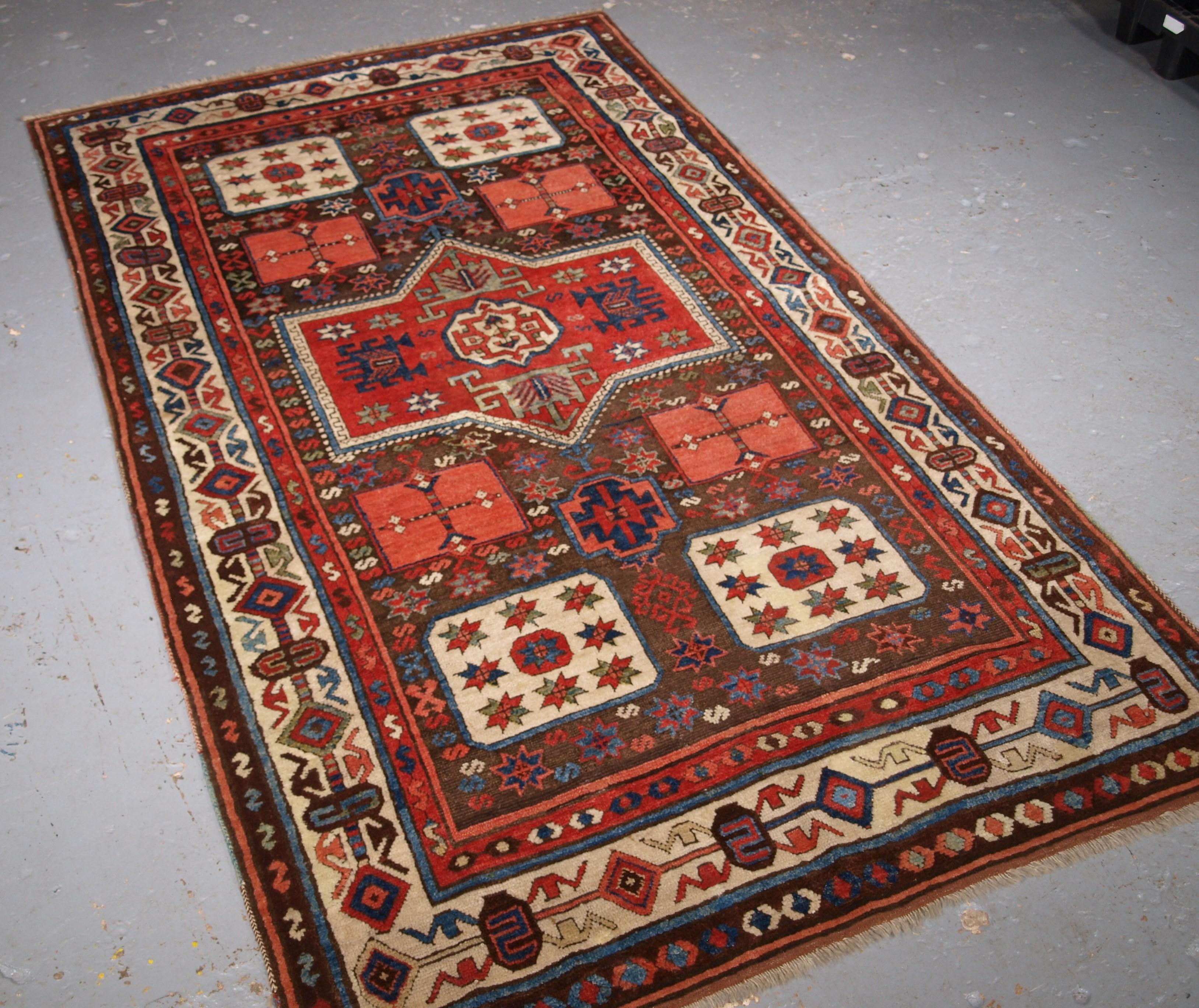 An antique South Eastern Anatolian Antep rug. This is a outstanding example of this scarce design which has many similarities to that found in Caucasian Karachov Kazak rugs, with the four corner boxes containing stars. The rug has a soft brown