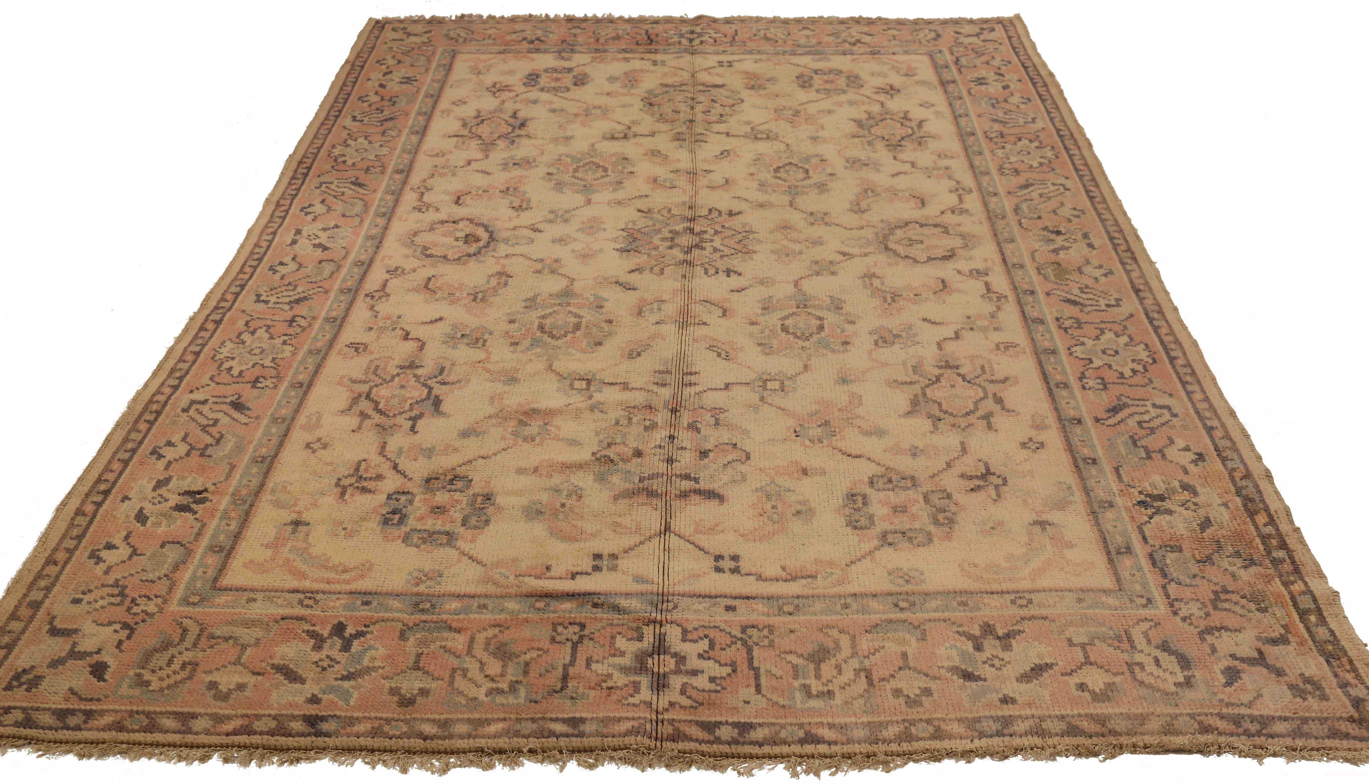 Antique Turkish area rug handwoven from the finest sheep’s wool. It’s colored with all-natural vegetable dyes that are safe for humans and pets. It’s a traditional Oushak design handwoven by expert artisans. It’s a lovely area rug that can be